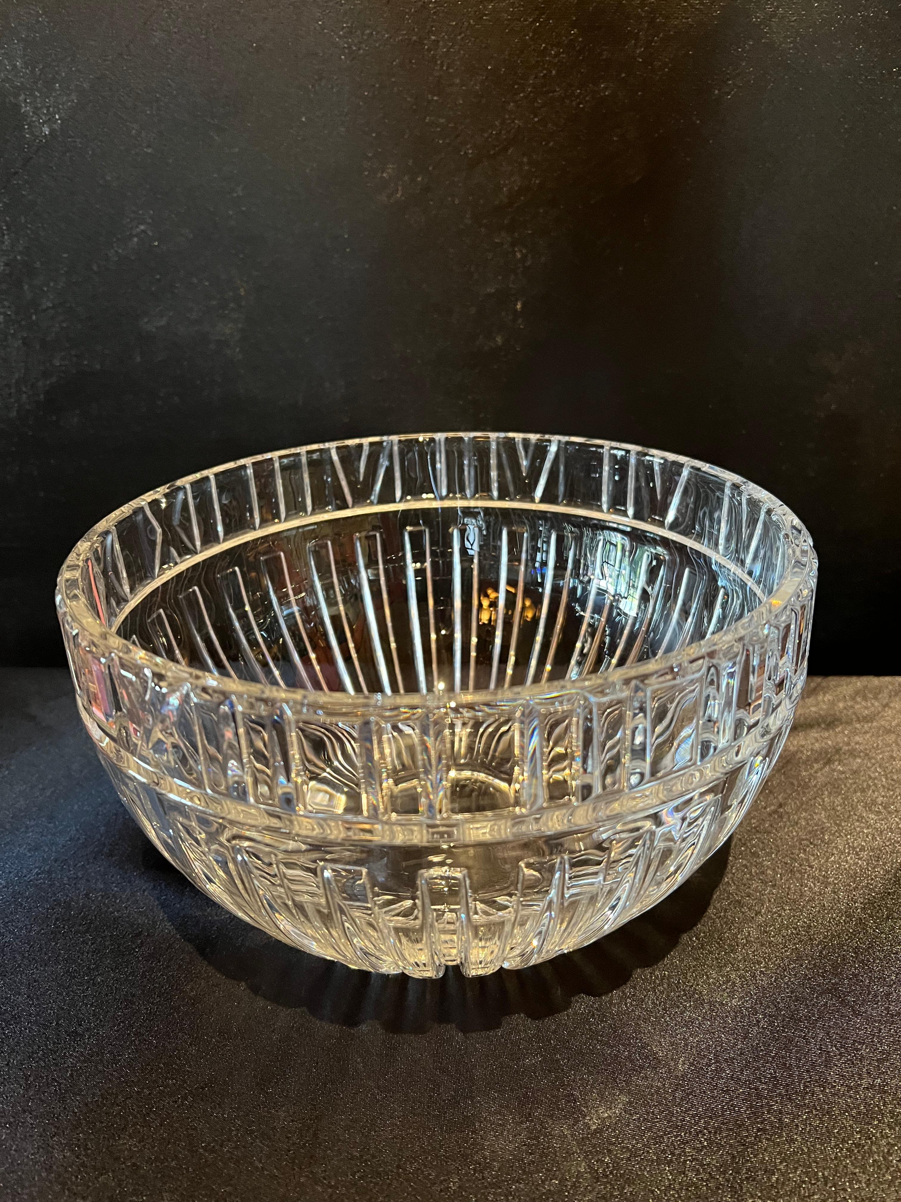 A wonderful decorative and functional Tiffany crystal bowl. Designed and released in the 1980's, this bowl has the classic roman numeral banding familiar with many of the jewelry pieces Tiffany is famous for. 

The bowl can work in any setting and