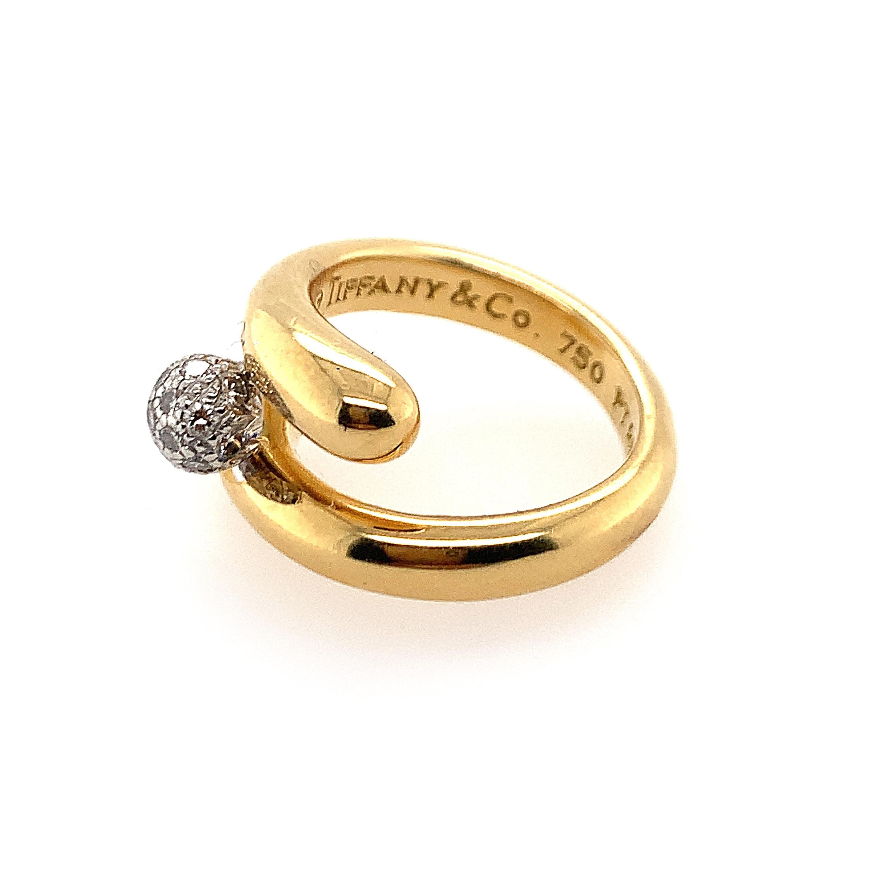 Tiffany & Co. Platinum 18K Y/gold diamond ring with diamond center weighing approx. 0.25 ct, ring size 6 1/4, weight 8.9 dwt.