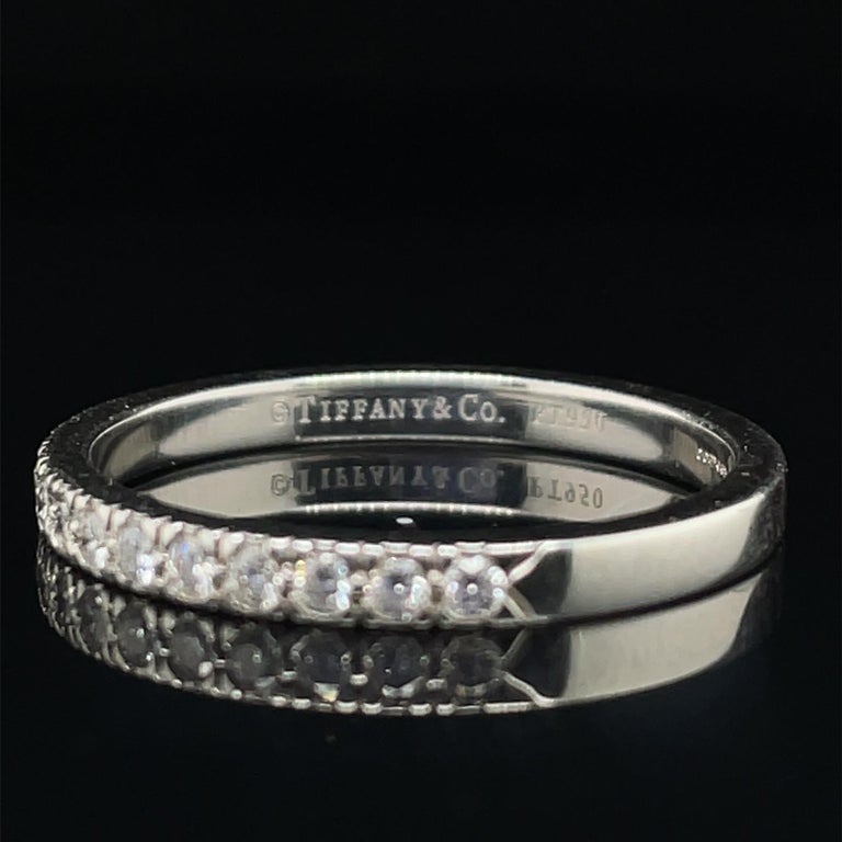 A Tiffany & Co diamond platinum half eternity ring.

This timeless and elegant eternity band, is grain set with a single row of seventeen round brilliant cut stones of 0.35 carats approximately estimated by ourselves as a G colour, VS1 clarity.

The