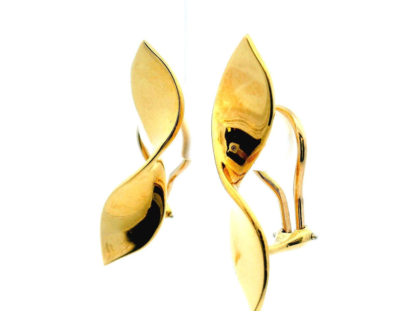 A striking pair of earrings crafted in gold by Tiffany & Co. in 2010. The design features elegant, flowing curves with a polished finish, creating a sophisticated silhouette.

Length: 33.5 mm
Width: 9.4 mm
Total Weight: 9.0 g
