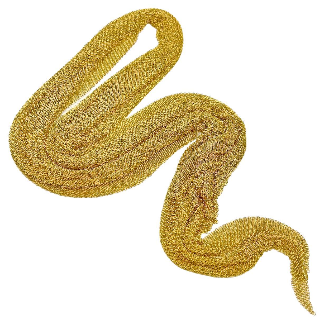 Elsa Peretti's original design scarf necklace for Tiffany & Co.  Mesh design crafted in 18k yellow gold and measuring 38