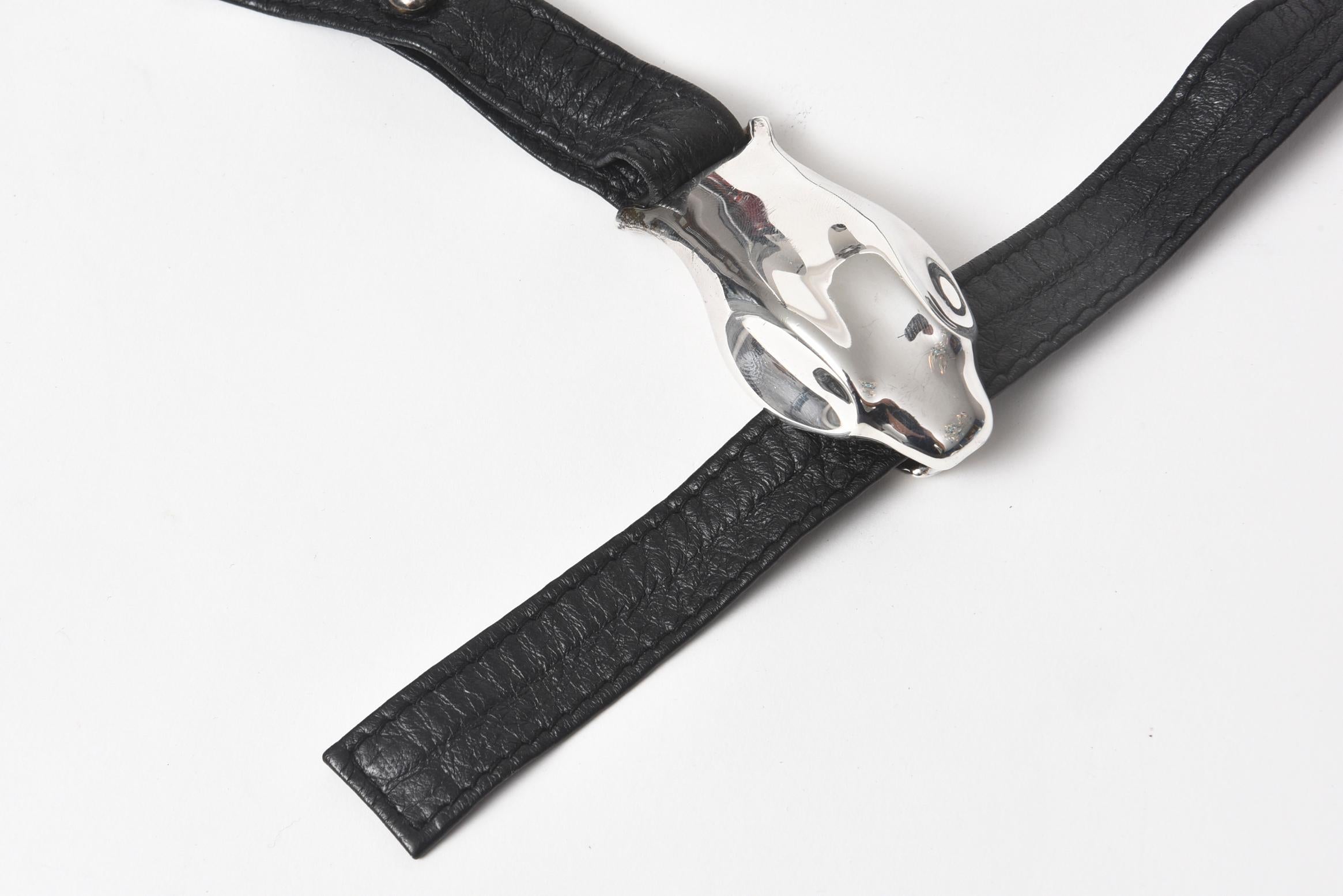 Vintage serpentine belt designed for Tiffany & Co. by Elsa Peretti (marked). The center of the belt has a three-dimensional snake head made of sterling silver. The snake's body is the black leather belt with a unique design that makes it fully