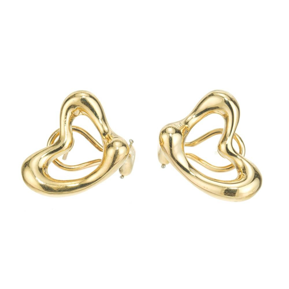 Authentic Tiffany & Co Peretti open heart 18k clip post earrings.

18k Yellow Gold
17.5 grams
Earrings stamped: Tiffany & Co 18k Peretti
Width: .85 inch or 21.75mm
Top to bottom: 18.16mm or .71 inch
Depth: 4.36mm