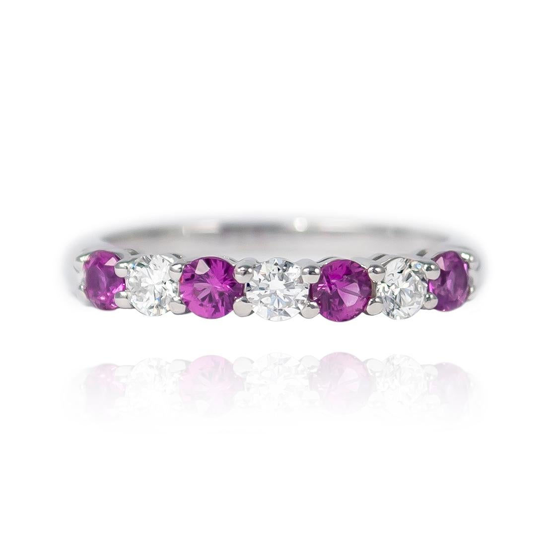 A beautiful and sophisticated Tiffany Embrace® platinum ring with 3 brilliant round diamonds = 0.24 ctw and 4 pink sapphires = 0.40 ctw. 3mm wide.

Purchase includes complimentary sizing. 