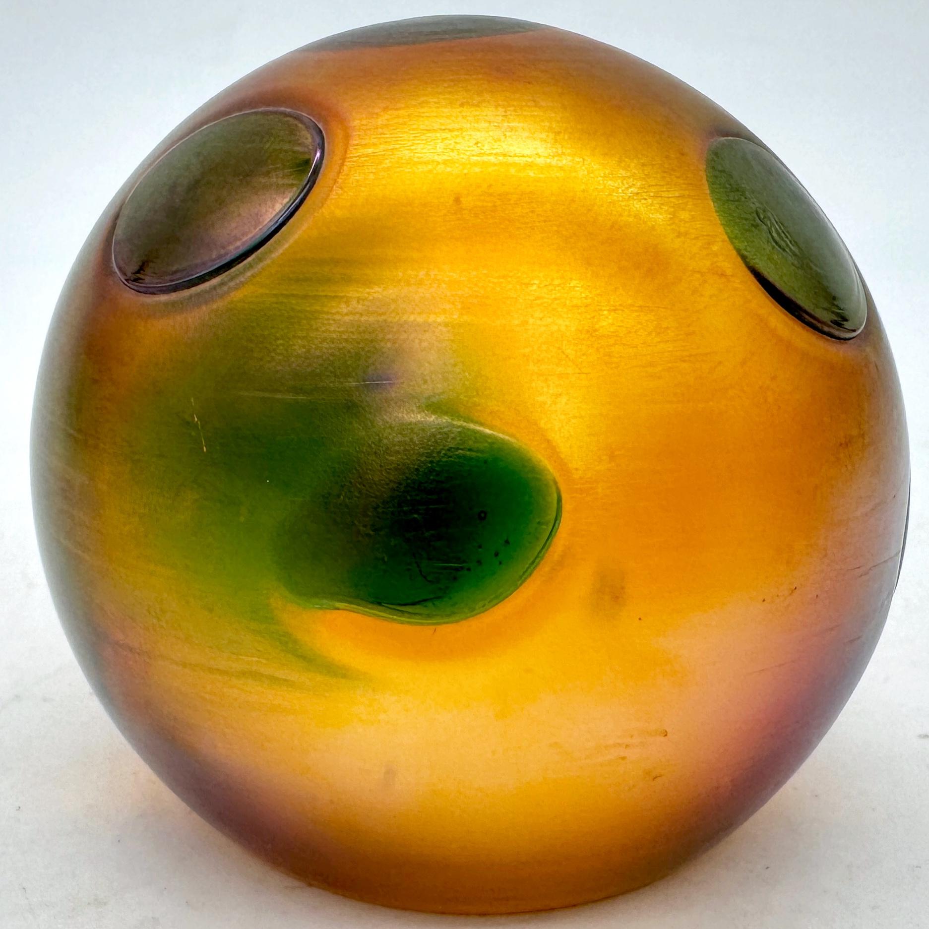 Tiffany Favrile Glass Art Nouveau Spotted Paperweight, Signed L.C.T. X17342

USA, 20th Century 

A remarkable example of Louis Comfort Tiffany’s mastery of glass artistry, this exquisite Favrile glass paperweight embodies the organic elegance of the