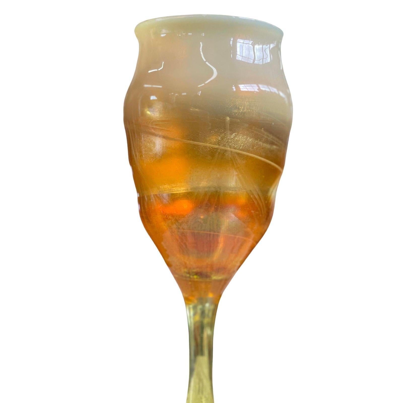 Louis Comfort Tiffany iridescent and gold favrile glass goblet. Paper label on base.
Dimensions:
9.75