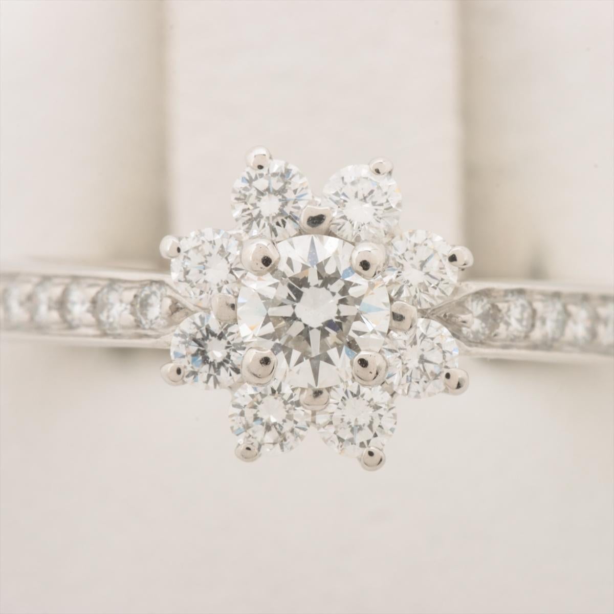Brand :  Tiffany&Co.
Description: Tiffany Flora Diamond rings 
Metal Type:  Pt950
Weight 4.5g
Condition: Preowned; small signs of wearing
Box - Included
Papers - Not Included