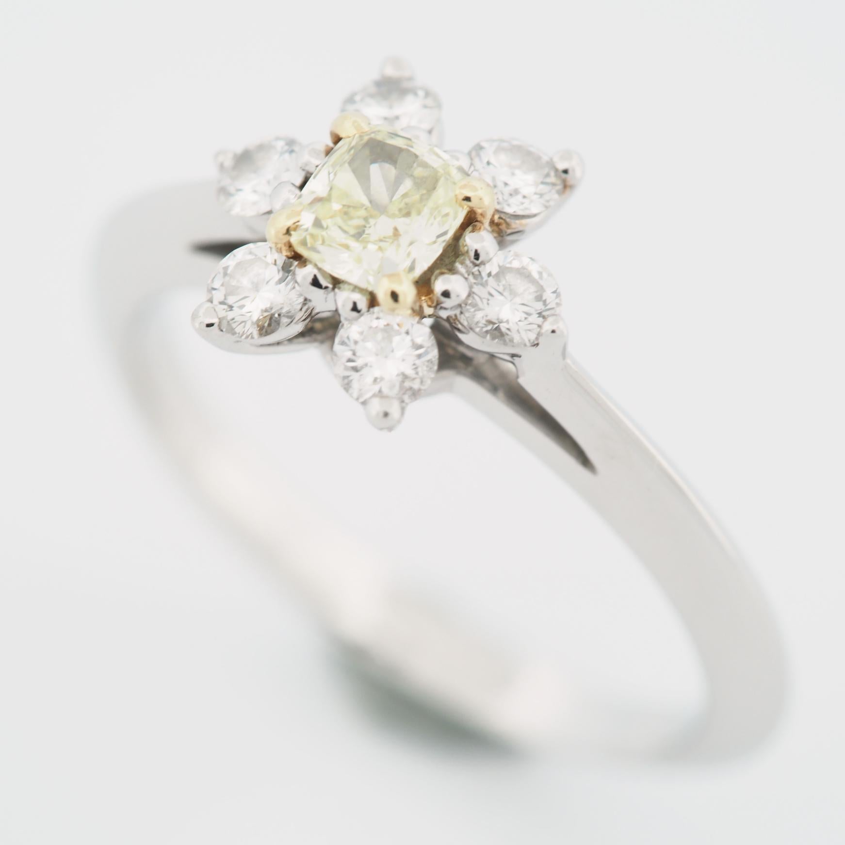 Item: Authentic Tiffany Buttercup Diamond Ring 
Stones: Diamond / 0.25ct
Color: Fancy Yellow
Clarity: VVS1
Polish: Excellent
Symmetry: Very Good
Fluorescence: None
Metal: Platinum 950 / 18K Gold
Ring Size: US SIZE 4.75 UK SIZE I 3/4
Internal