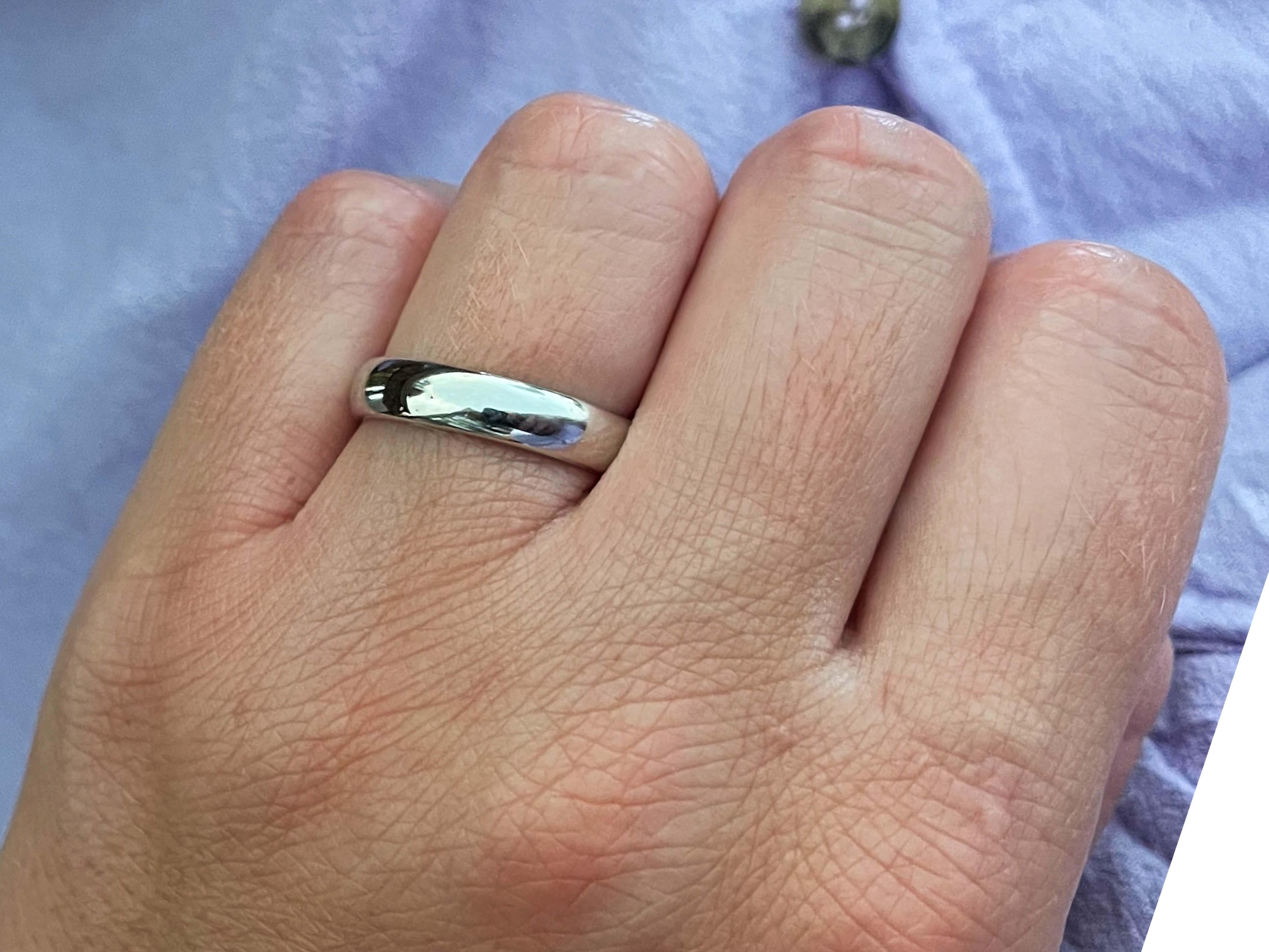 Authentic Tiffany & Co. wedding band. This band is beautifully crafted in platinum 950 with a high polish finish. The band is 4.5 mm wide.  The band is hallmarked 