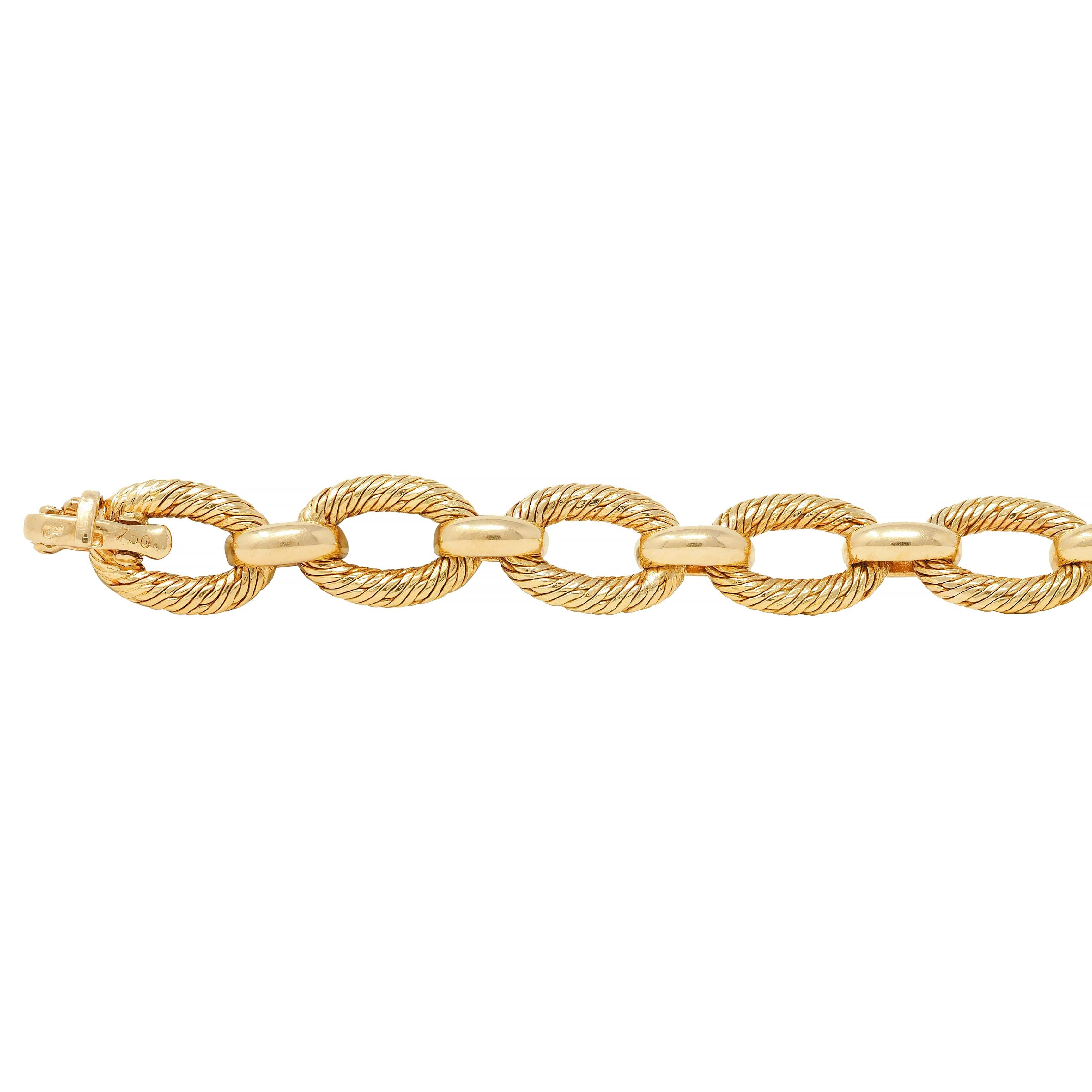 Comprised of oval and bar links alternating in pattern
Oval links feature engraved twist texture
Bar links are smooth with high polish 
Completed by concealed clasp closure
Stamped for 18 karat gold 
Fully signed Tiffany & Co., France
Circa: