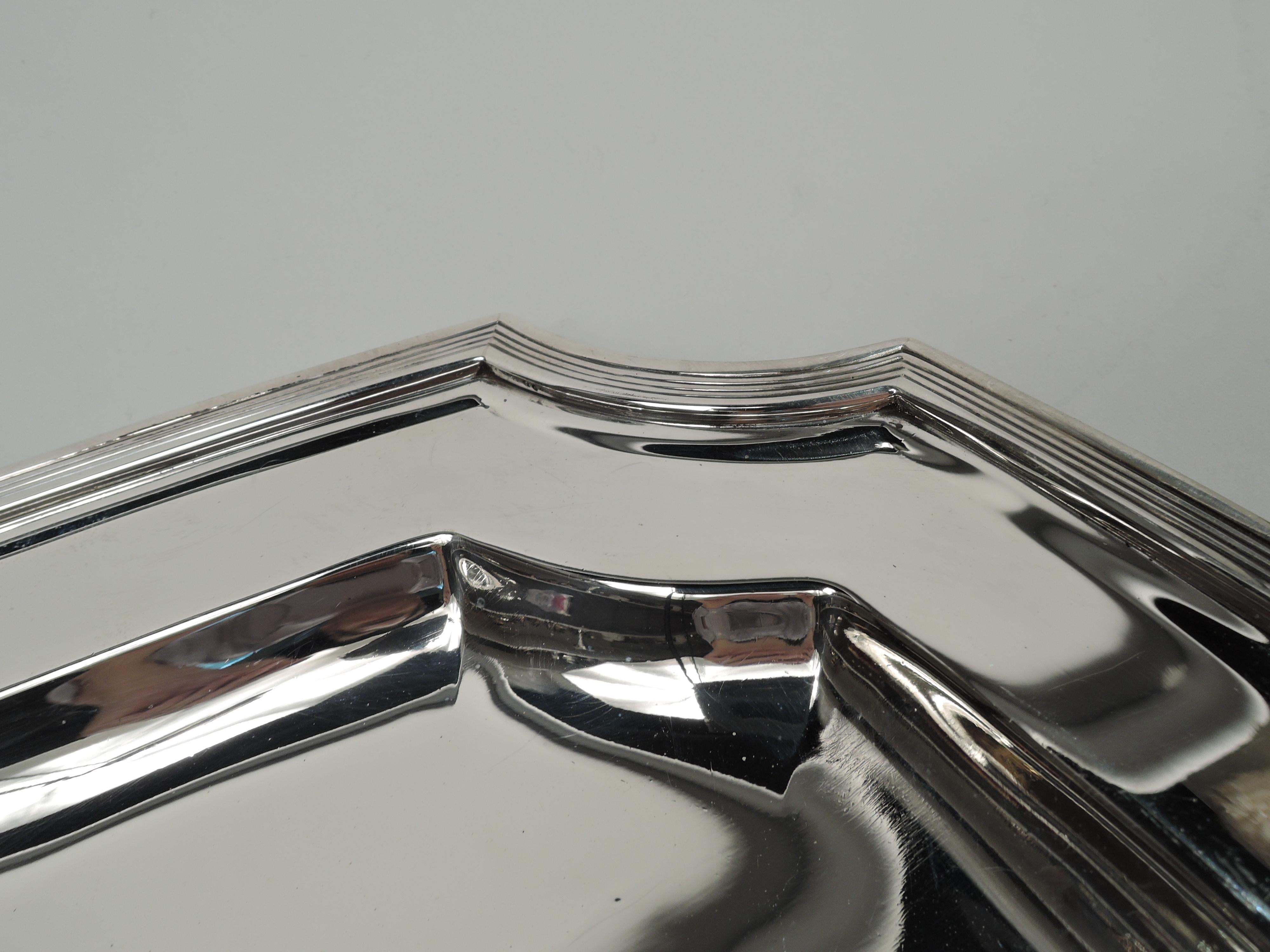 Hampton sterling silver serving tray. Made by Tiffany & Co. in New York, ca 1924. Rectangular with curved sides and concave corners. Deep well, wide shoulder, and reeded rim. Fully marked including maker’s stamp, pattern no. 20370 (first produced in