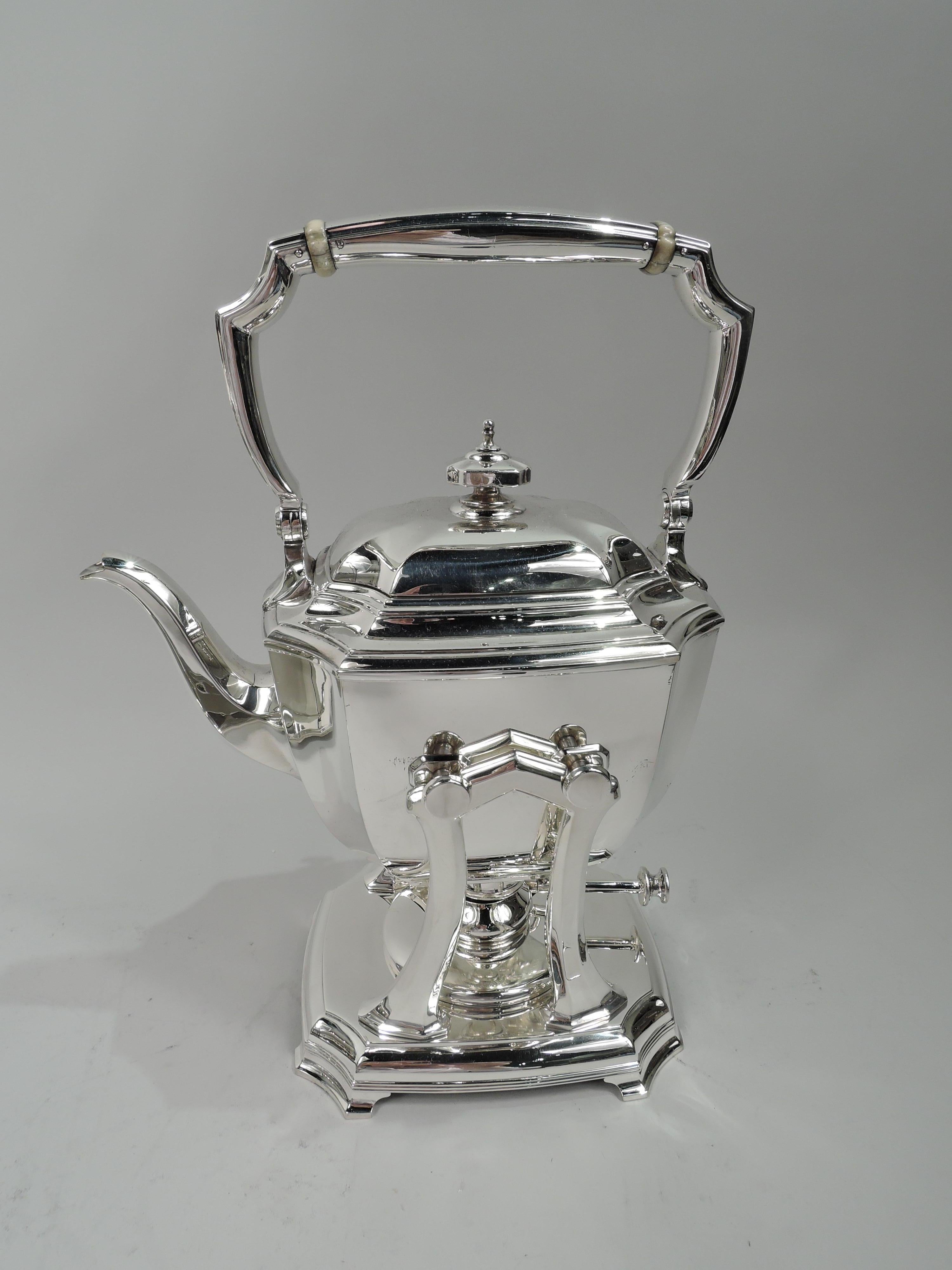 Hampton sterling silver coffee and tea set on tray. Made by Tiffany & Co. in New York. This set comprises 7 pieces: Hot water kettle on stand, coffeepot, teapot, creamer, sugar, and waste bowl on tray. Rectilinear with gently curved sides and