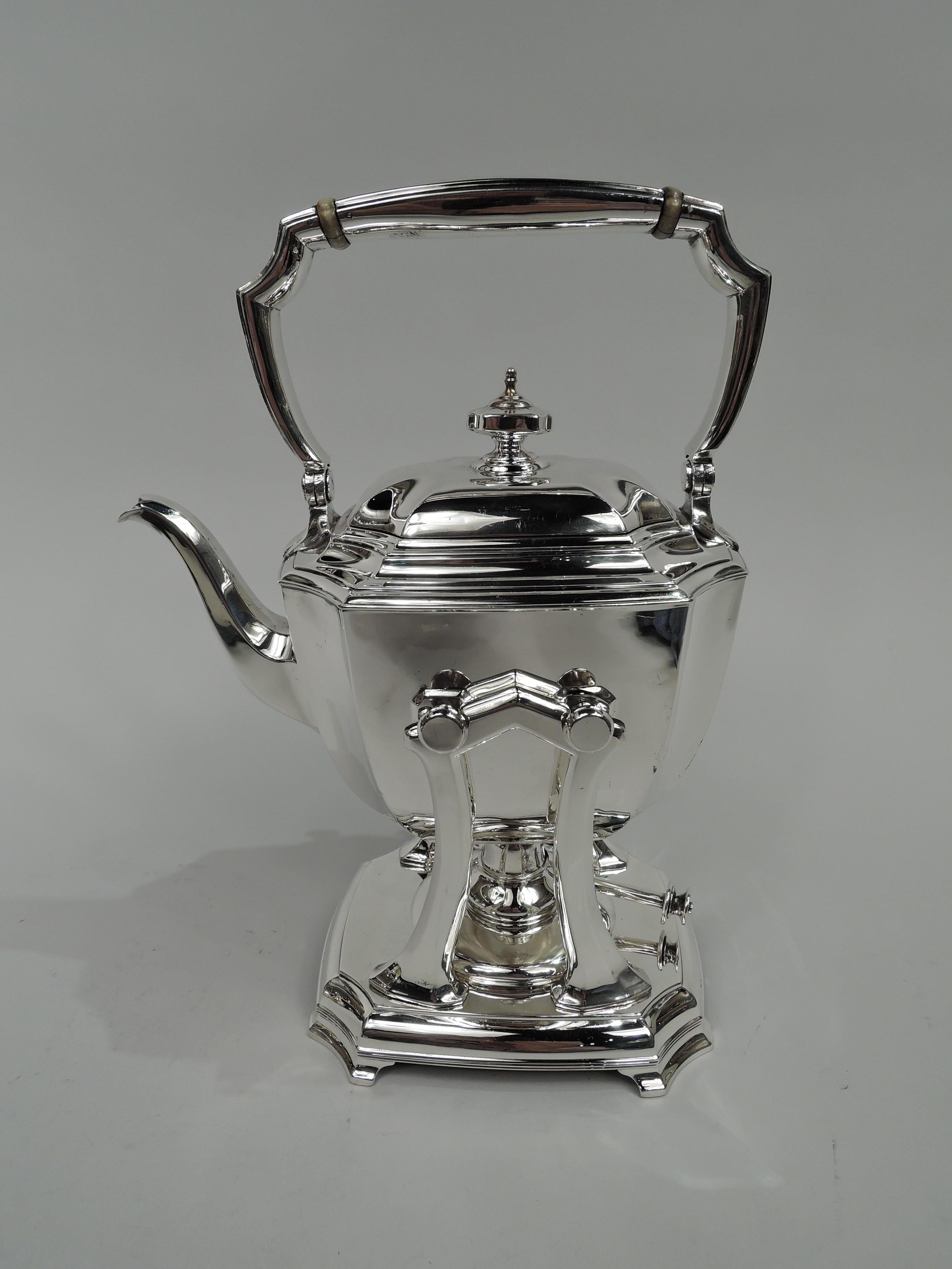 Hampton sterling silver coffee and tea set on tray. Made by Tiffany & Co. in New York, ca 1930. This set comprises 7 pieces: Hot water kettle on stand, coffeepot, teapot, creamer, sugar, and waste bowl on tray.

Rectilinear with gently curved