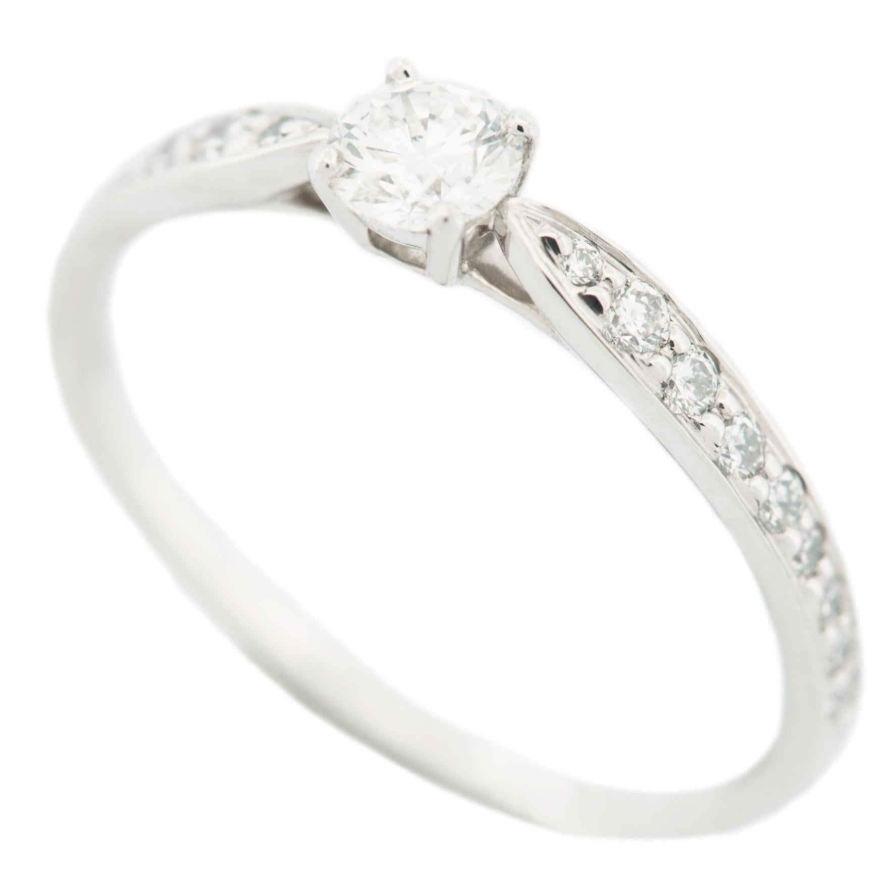 Item: Tiffany Harmony Solitaire Diamond Ring 
Stones: Diamond / 0.23ct (center stone) with 18 pave diamonds (approx. 0.11ct)
Color: ---
Clarity:---
Polish: ---
Symmetry: ---
Fluorescence: ---
Metal: Platinum 950
Ring Size: SIZE 5.75 UK SIZE K