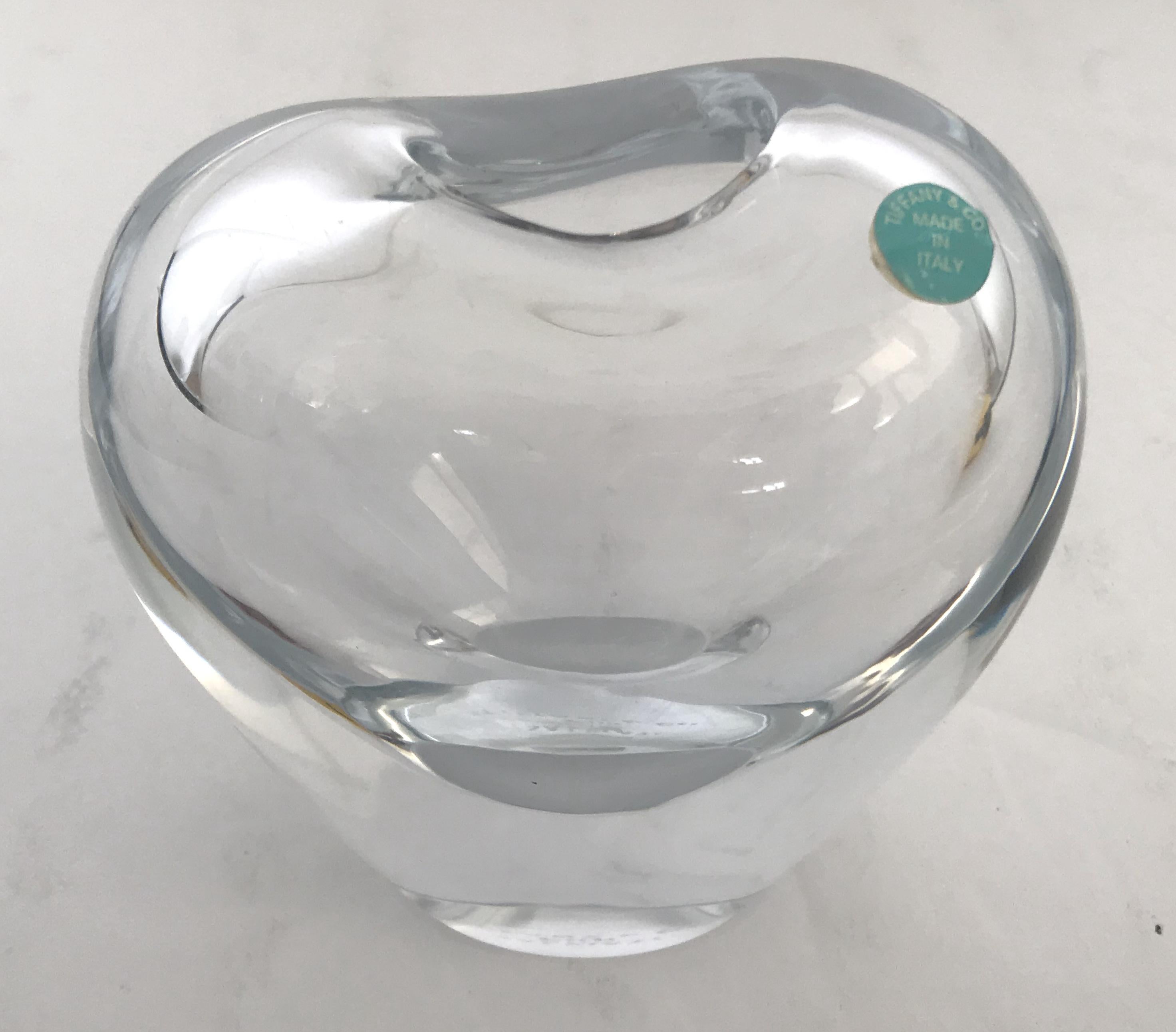 Lovely heart shaped hand blown clear Murano glass vase, made in Italy by Salviati for Tiffany & Co, circa 1980
Original sticker on the vase, and original mark etched at the base
Measures: height 4 inches, width 4 inches, depth 3 inches
1 in stock in