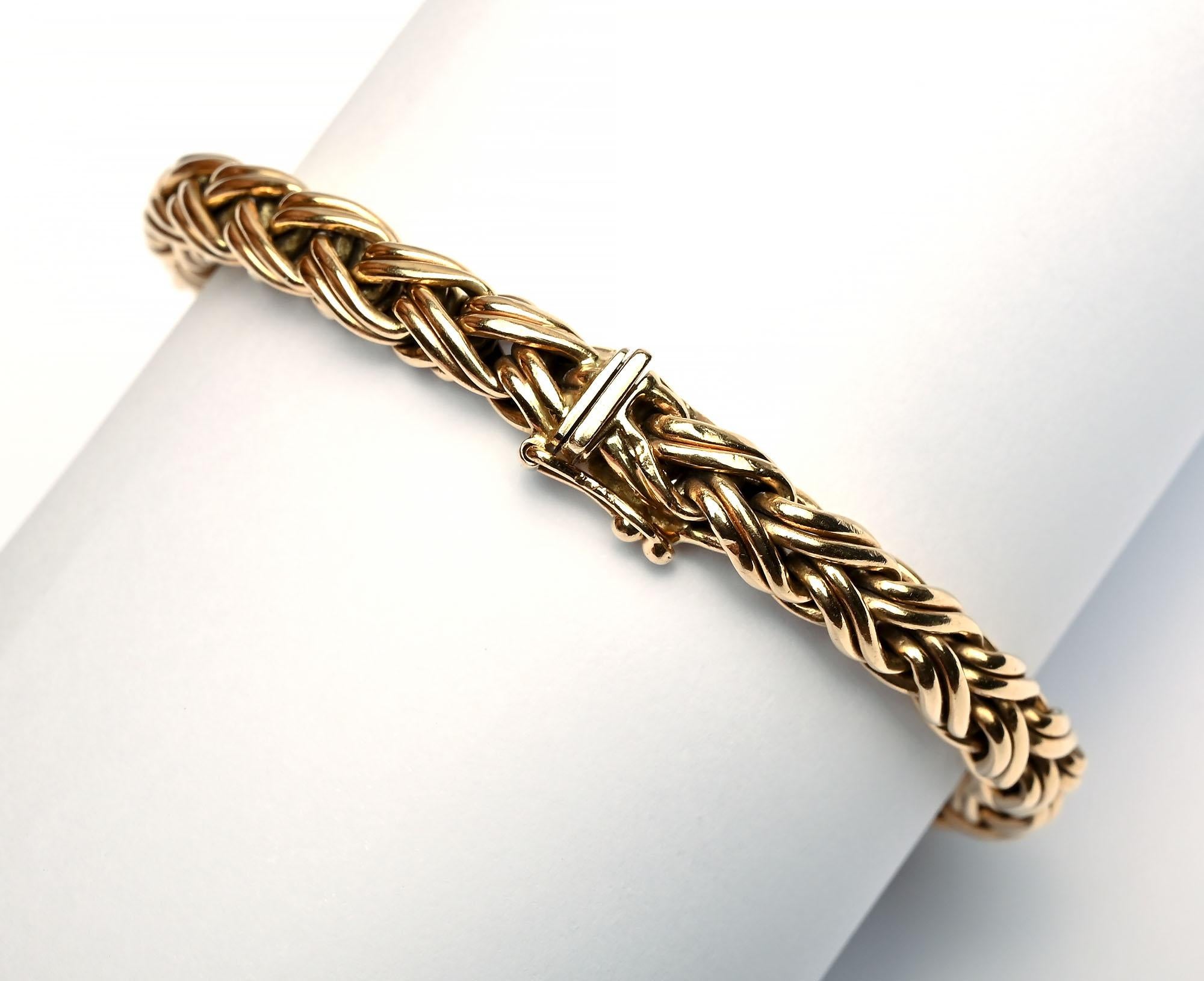 Classic herringbone chain bracelet by Tiffany that can be worn well by itself or as part of a group. The bracelet is 1/4 inch wide and a hair less than 7 1/2 inches long. It has a push clasp and safety, The bracelet is 14 karat gold. It comes in the