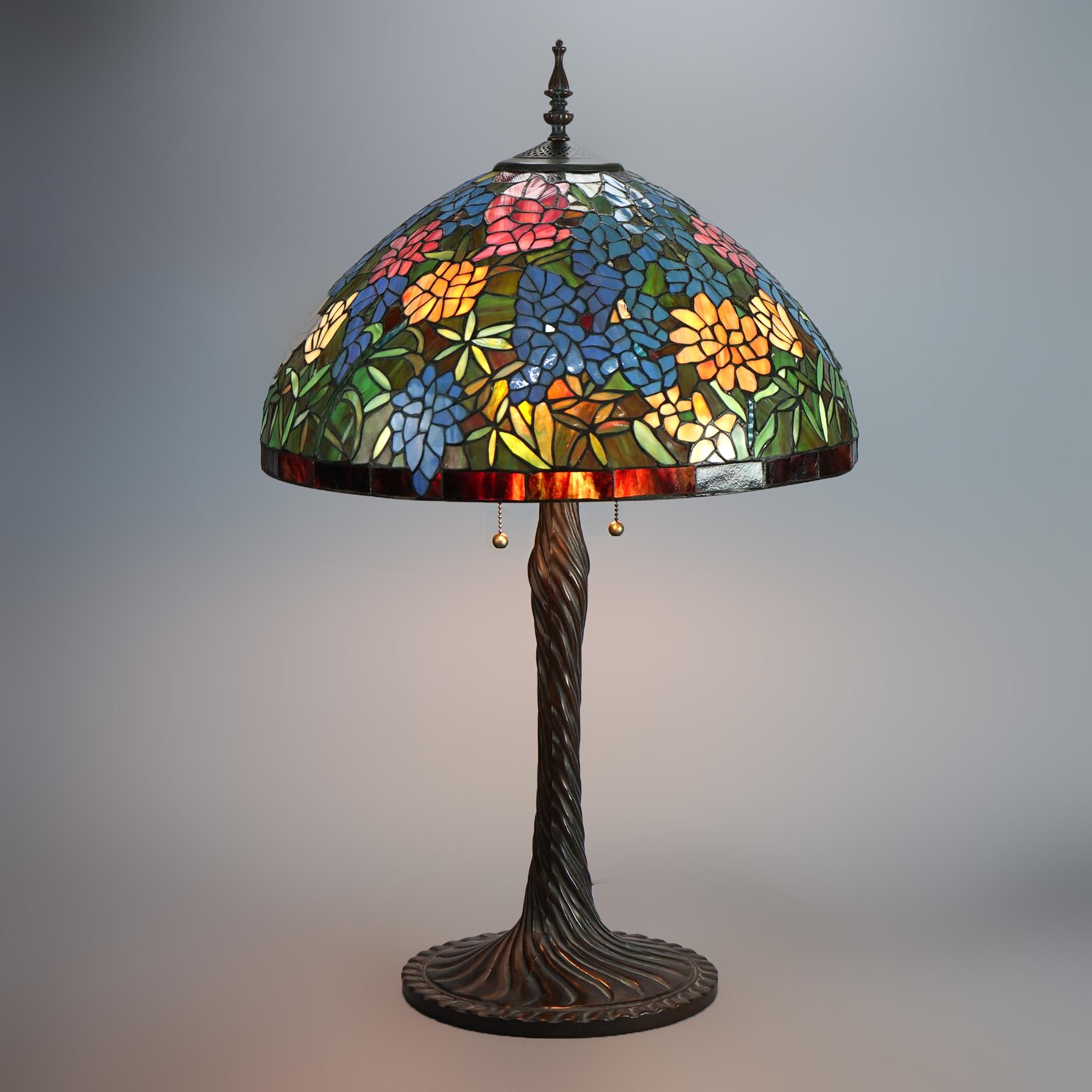 Tiffany Inspired Leaded Stained Glass Lamp with Double Socket Base and Garden Flower Patterned Dome Form Shade 20thC

Measures- 33''H x 20''W x 20''D