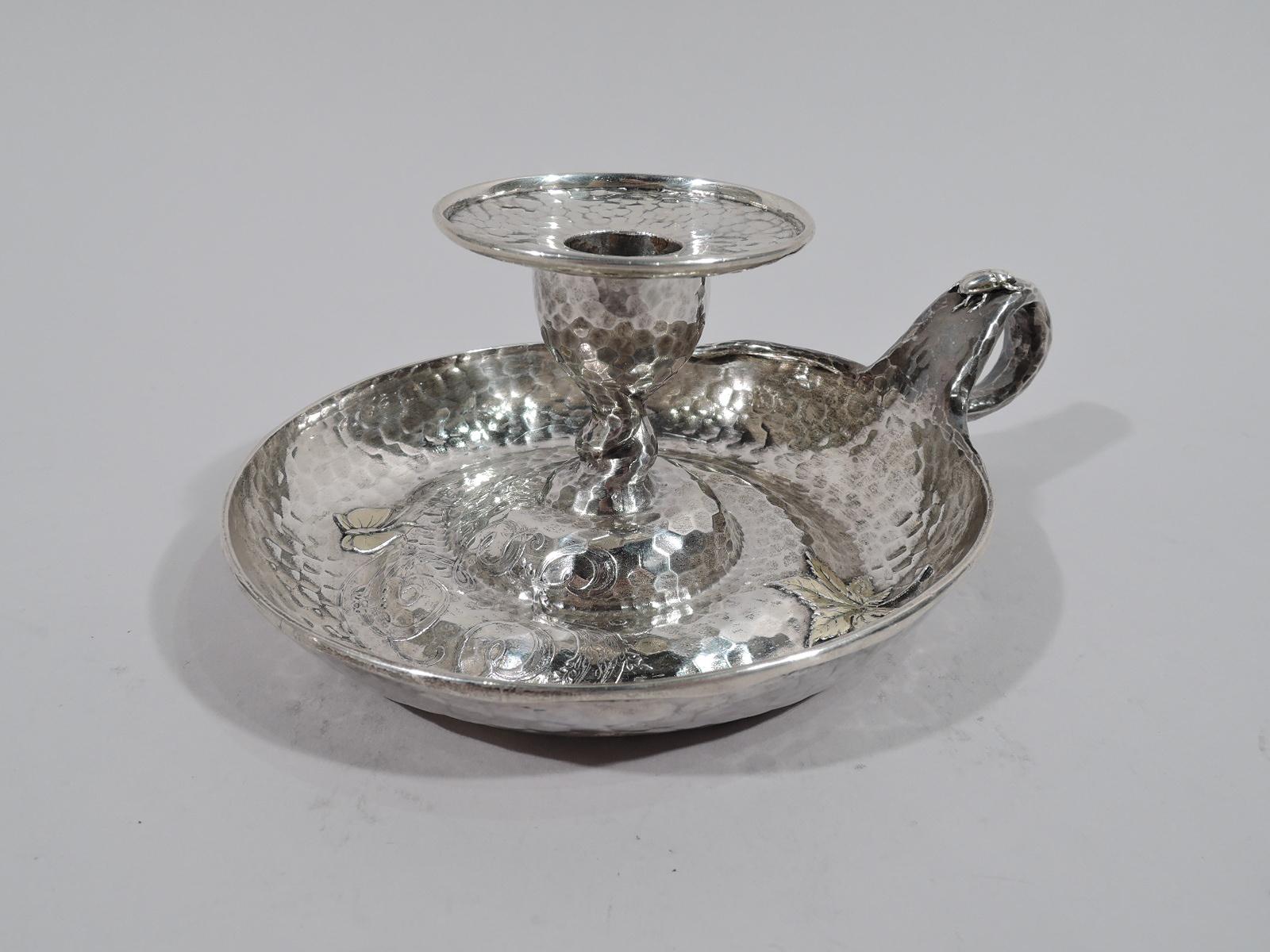 Japonesque Arts & Crafts applied sterling silver chamberstick. Made by Tiffany & Co. in New York, ca 1879. Deep bowl and twisted-loop handle with tendril tail. Urn socket with wide and flat detachable bobeche on central raised spiral. Beatles on