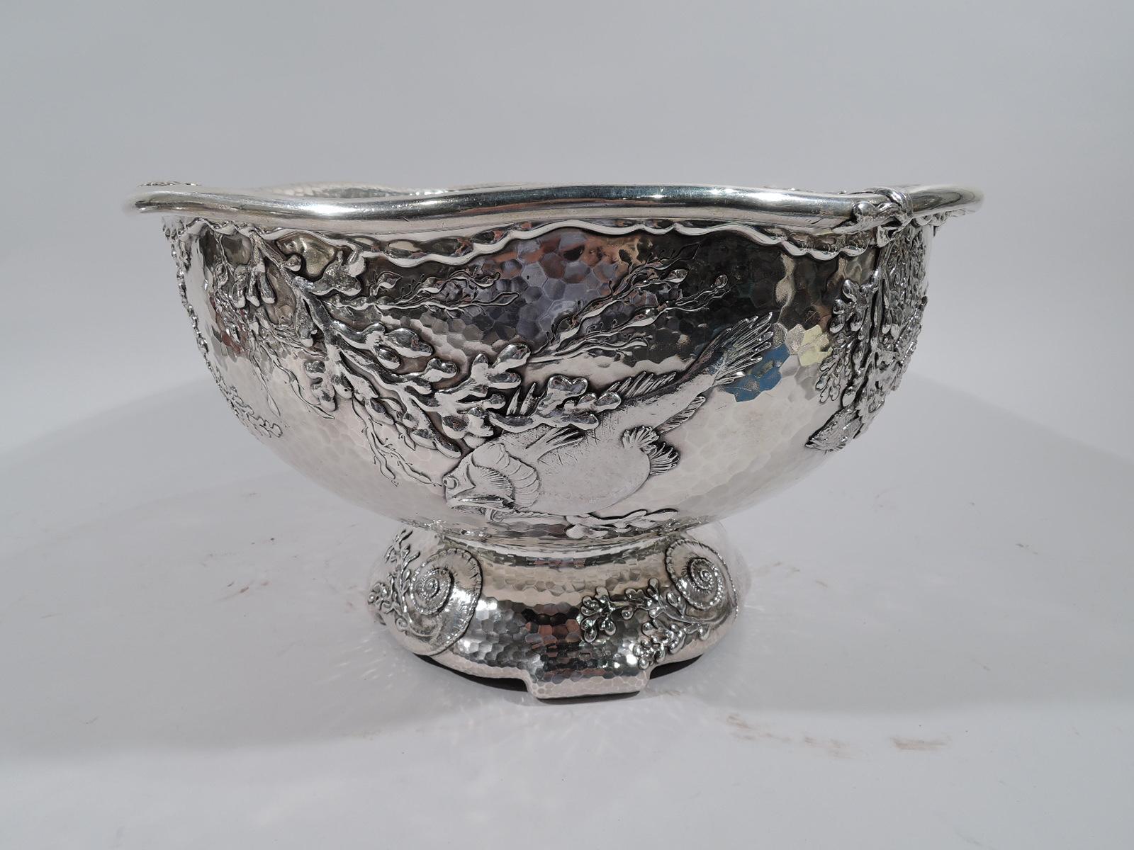 Exquisite Tiffany Japonesque sterling silver centerpiece with applied fish, circa 1881.

Exterior decorated with scaly and gaping fish swimming among drifting, swaying plants. Ornament is applied and chased on honeycomb hand-hammered ground. Fine