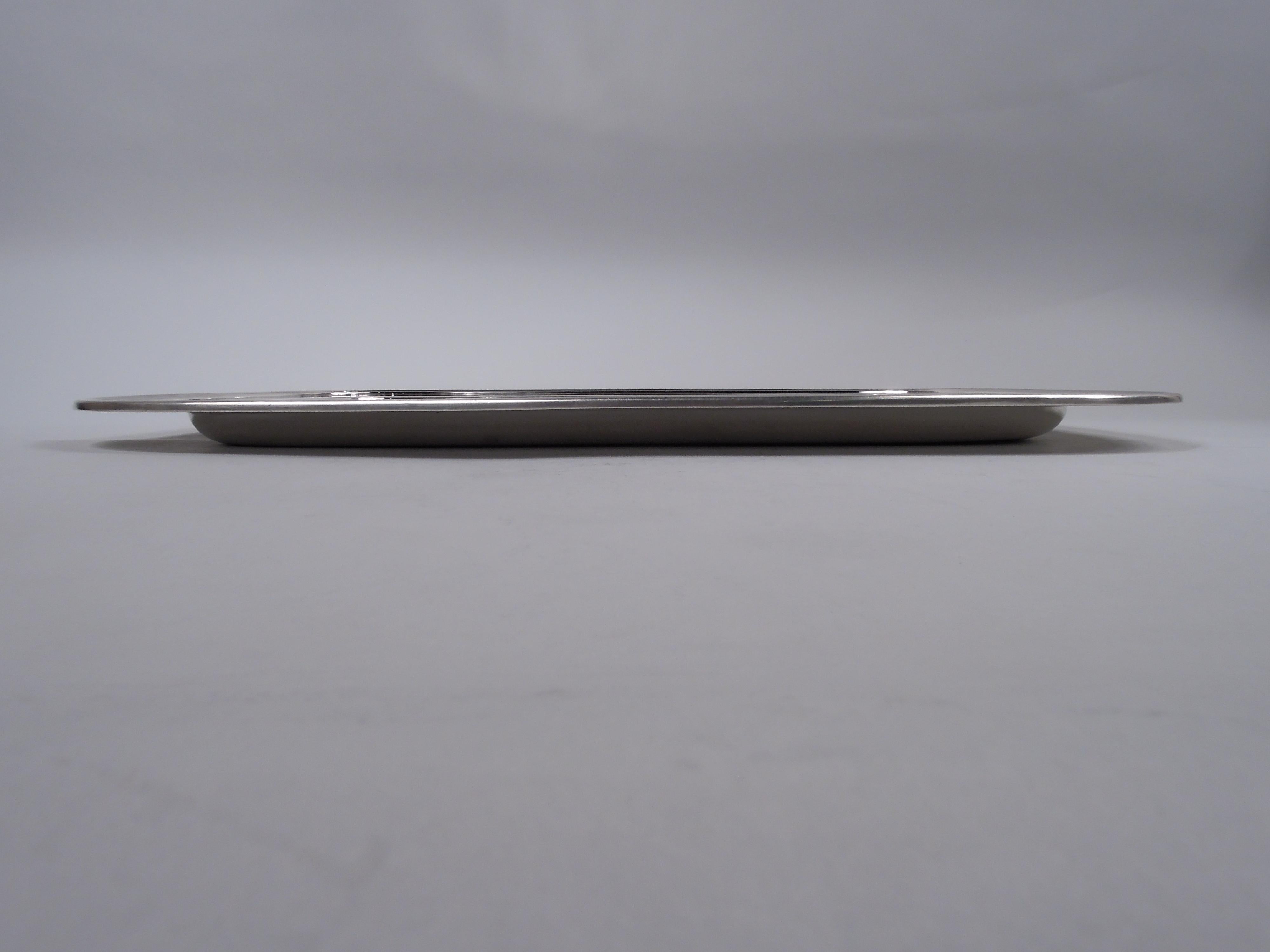 Large and heavy Modern sterling silver rectangular tray. Made by Tiffany & Co. in New York. Rectangular with curved corners, deep well, wide shoulder, and molded rim. Fully marked including maker’s stamp, pattern no. 21943, and director’s letter M