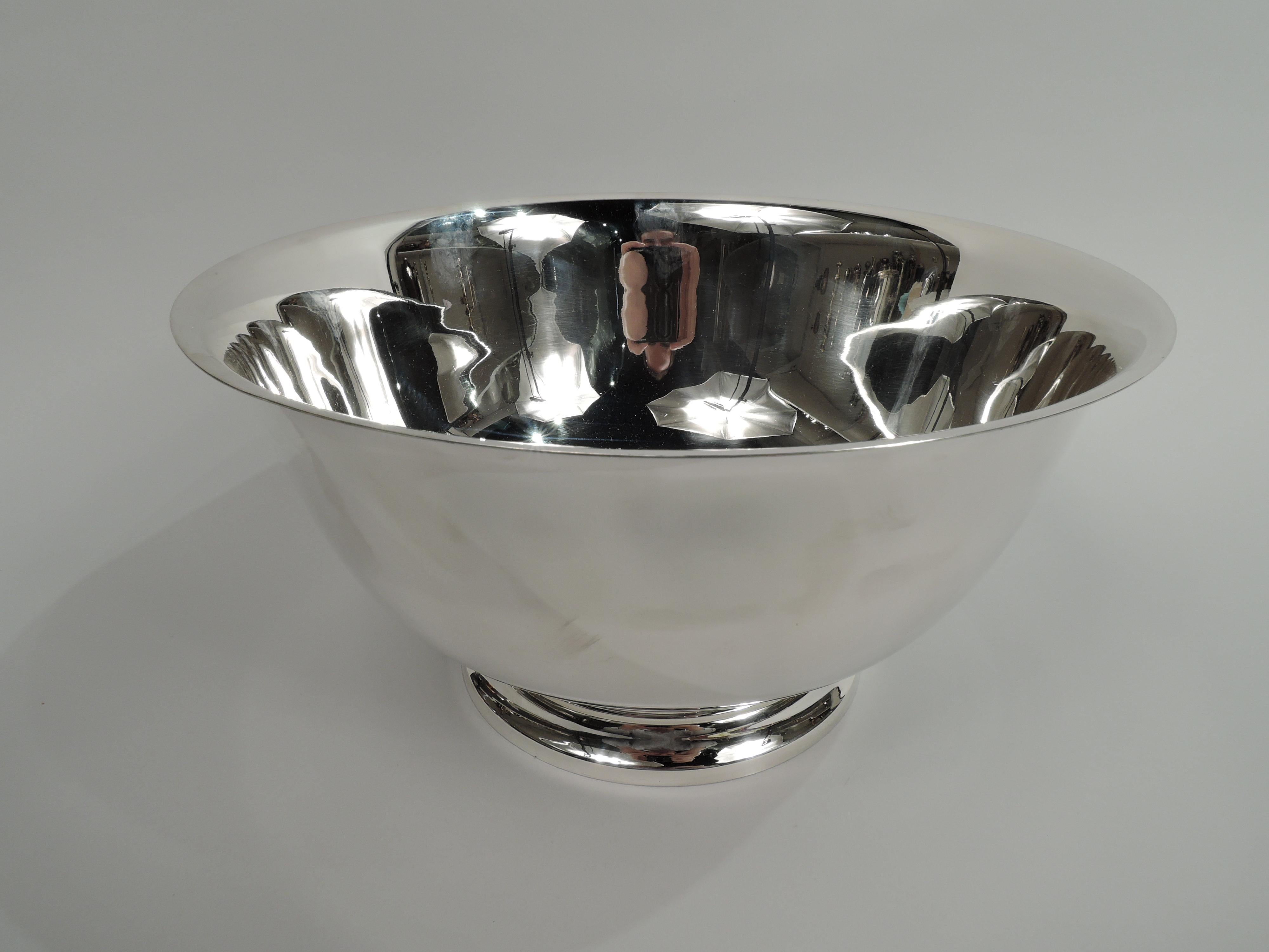 Large and traditional sterling silver Revere bowl. Made by Tiffany & Co. in New York. Tapering sides with flared rim, curved bottom, and raised foot. Great trophy potential with lots of room for engraving. Marked “Tiffany & Co. / Makers / Sterling