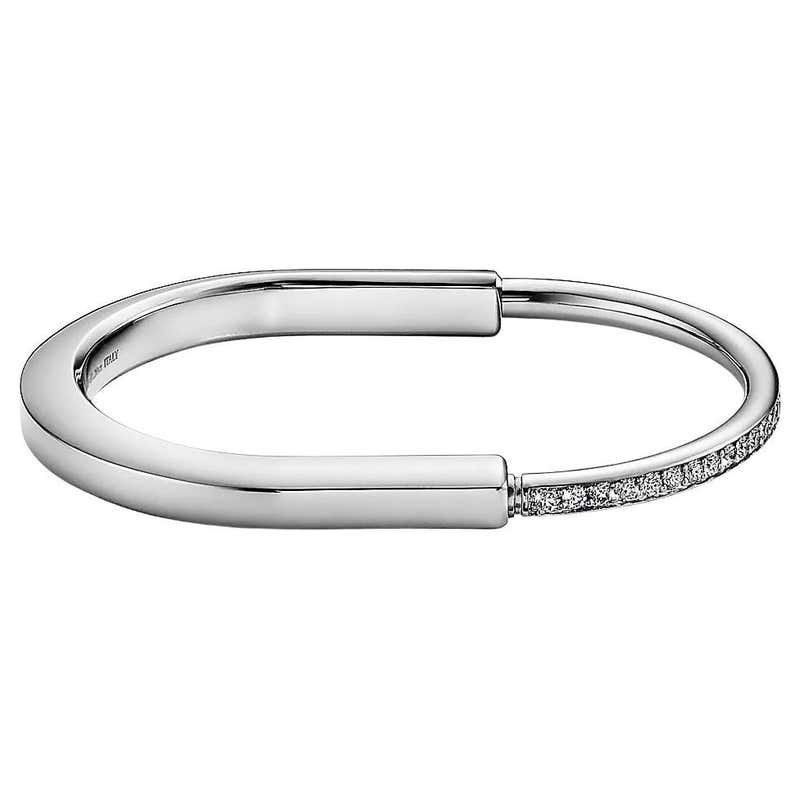 Push Lock Bangle Tiffany Lock Bangle in 18k White Gold with Half Pavé Diamonds at 1stDibs