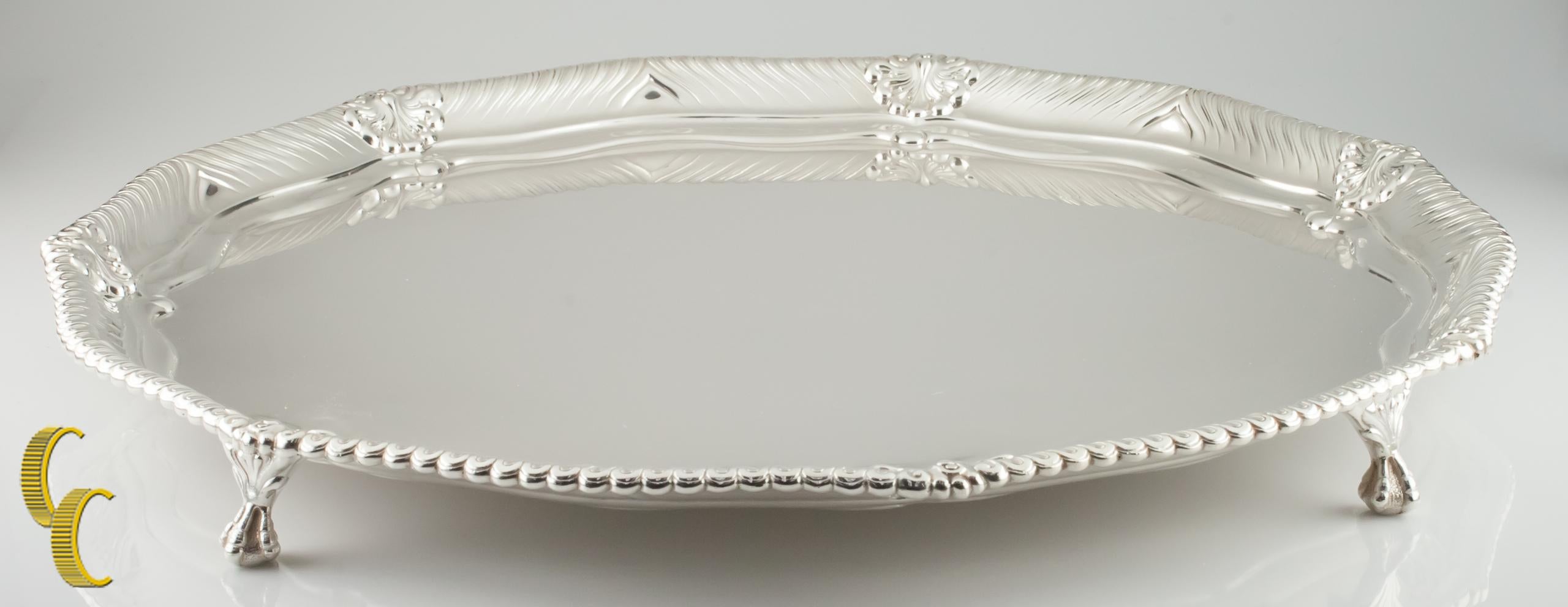 
Tiffany Makers Sterling Silver Large Footed Tray 1888 86.5 ounces Great Antique 

Gorgeous Seven-Sided Round Tiffany Sterling Silver Platter
Features Talon-motif on foots
Diameter: 18 3/4