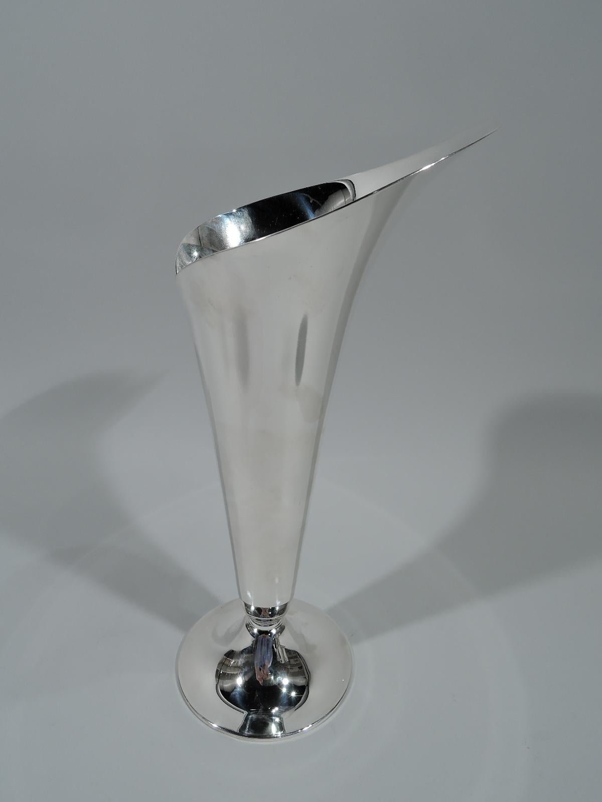 Mid-Century Modern sterling silver vase. Made by Tiffany & Co. in New York. In form of abstract wrapped leaf with asymmetrical mouth and irregular seam. Raised round foot. Hallmark includes postwar pattern no. 23425. Weight: 19 troy ounces.