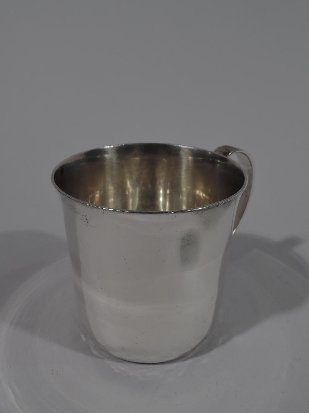 Mid-Century Modern sterling silver baby cup. Made by Tiffany & Co. in New York. Plain with flared rim and C-scroll handle. Lots of room for engraving. Fully marked including director’s letter M (1947-1956) and pattern no. 23245 (first produced in