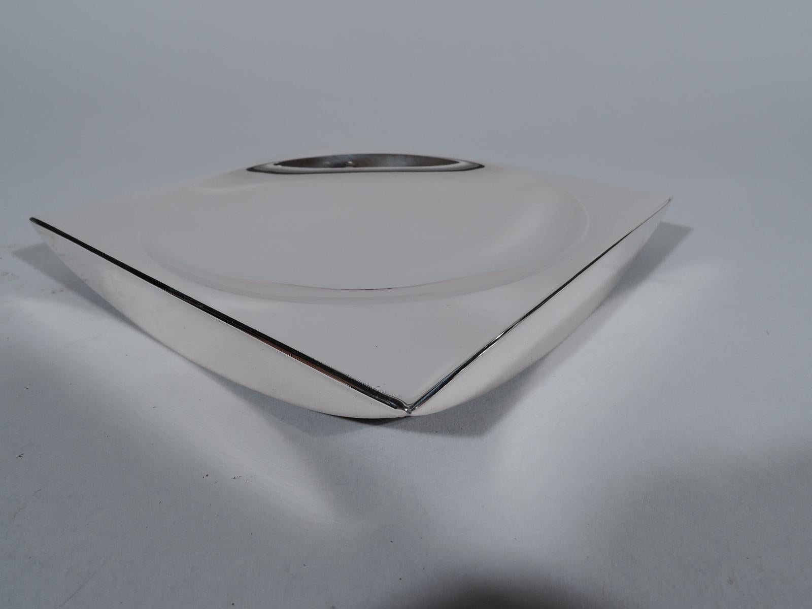 Midcentury Modern sterling silver dish. Made by Tiffany & Co. in New York. Square with shallow round well and lunette sides. Full-blown geometric style. Fully marked including postwar pattern no. 25347. Weight: 7 troy ounces.