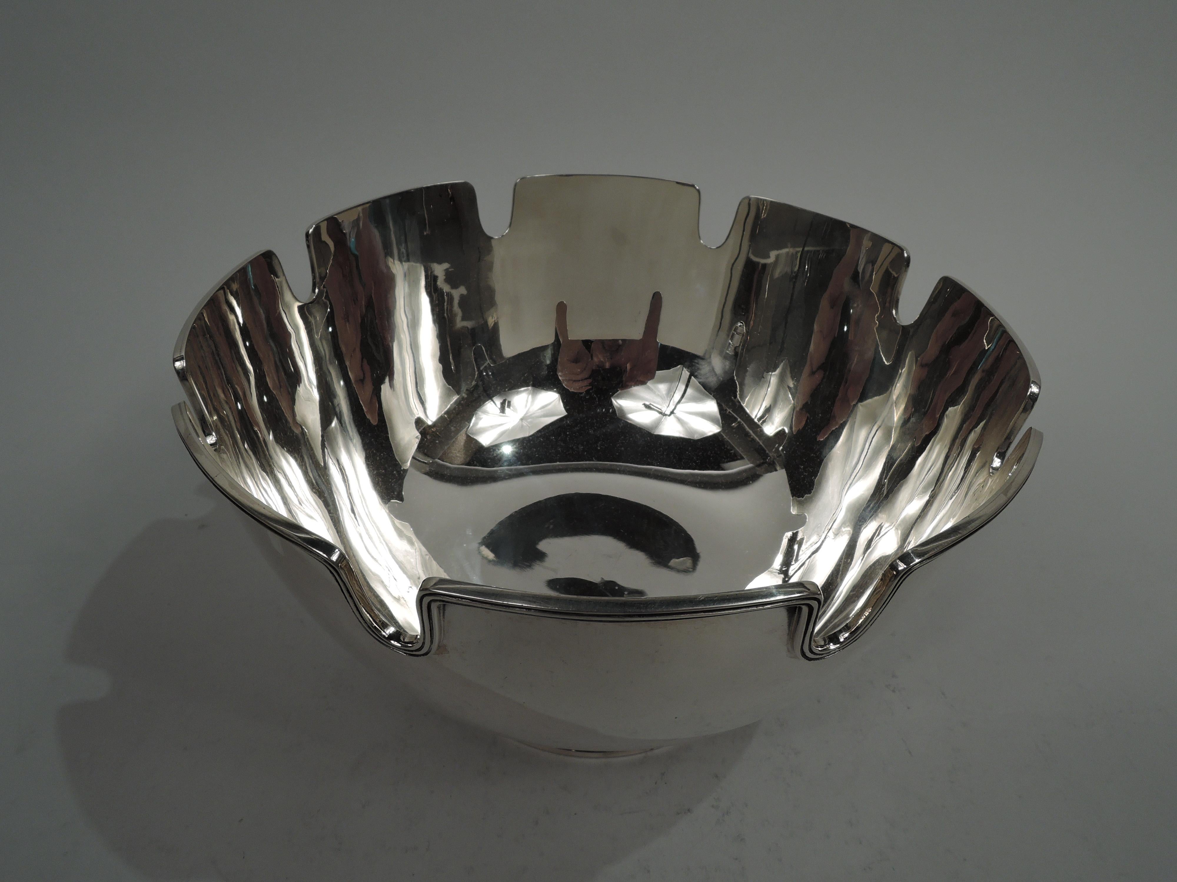 Mid-Century Modern sterling silver monteith bowl. Made by Tiffany & Co. in New York. Curved sides and reeded curvilinear rim; raised and spread foot. Stylish for serving and presentation. Plenty of room for engraving. Fully marked including maker’s