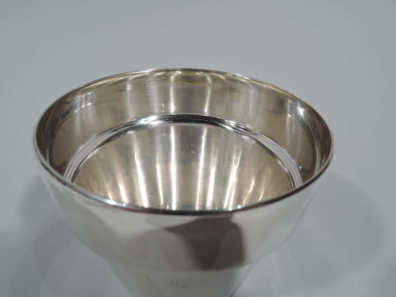 Modern sterling silver vase. Traditional flower pot form with straight and tapering sides and overhanging top. Bottom solid. Marked “©2003 Tiffany & Co. / Makers / Sterling Silver / 24037 / 925”. Weight: 6 troy ounces.