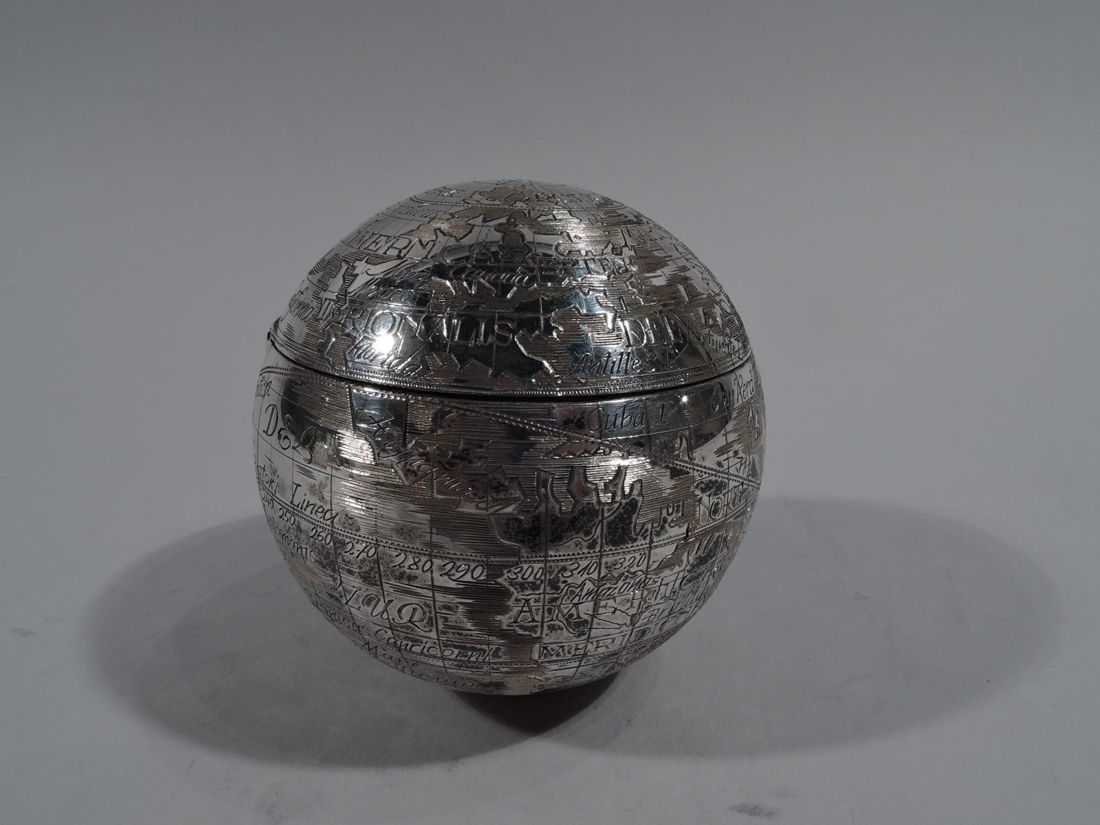 Modern sterling silver globe box. Retailed by Tiffany & Co. in New York. Never lose your cuff links again all the while holding the world in the palm of your hand. Continents, oceans, and countries labeled in a variety of scripts and languages.