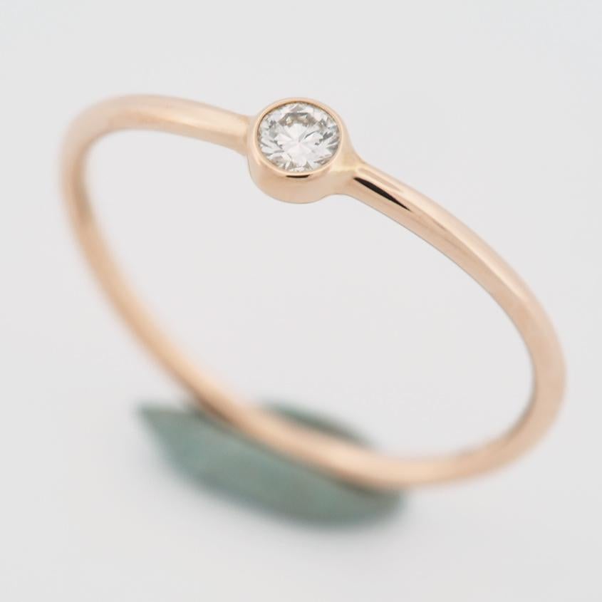 Item: Tiffany Peretti Wave Single Row Diamond Ring
Stones: Diamond (0.06ct)
Metal: 18K Rose Gold
Ring Size: US SIZE 5.25 UK SIZE J 3/4
Internal Diameter: 15.95 mm
Measurements: 1.1 - 3.2 mm
Weight: 1.0 Grams
Condition: Used (repolished)
Retail