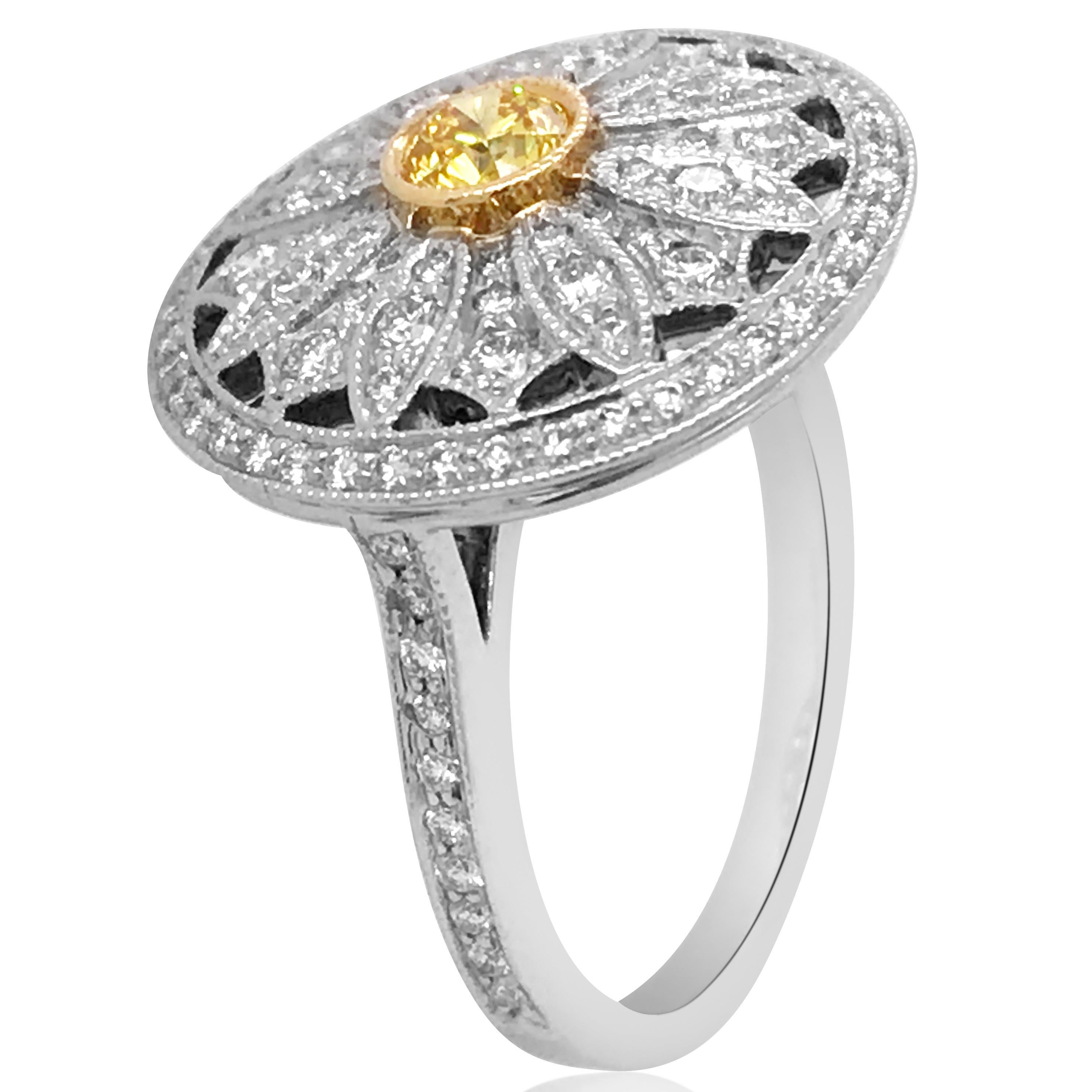 Containing one round brilliant cut yellow diamond approx. 0.25 ct and numerous round brilliant cut diamonds total approx. 1 ct. Mounted in platinum with yellow gold detail. Ring size 6.

Stamp: 