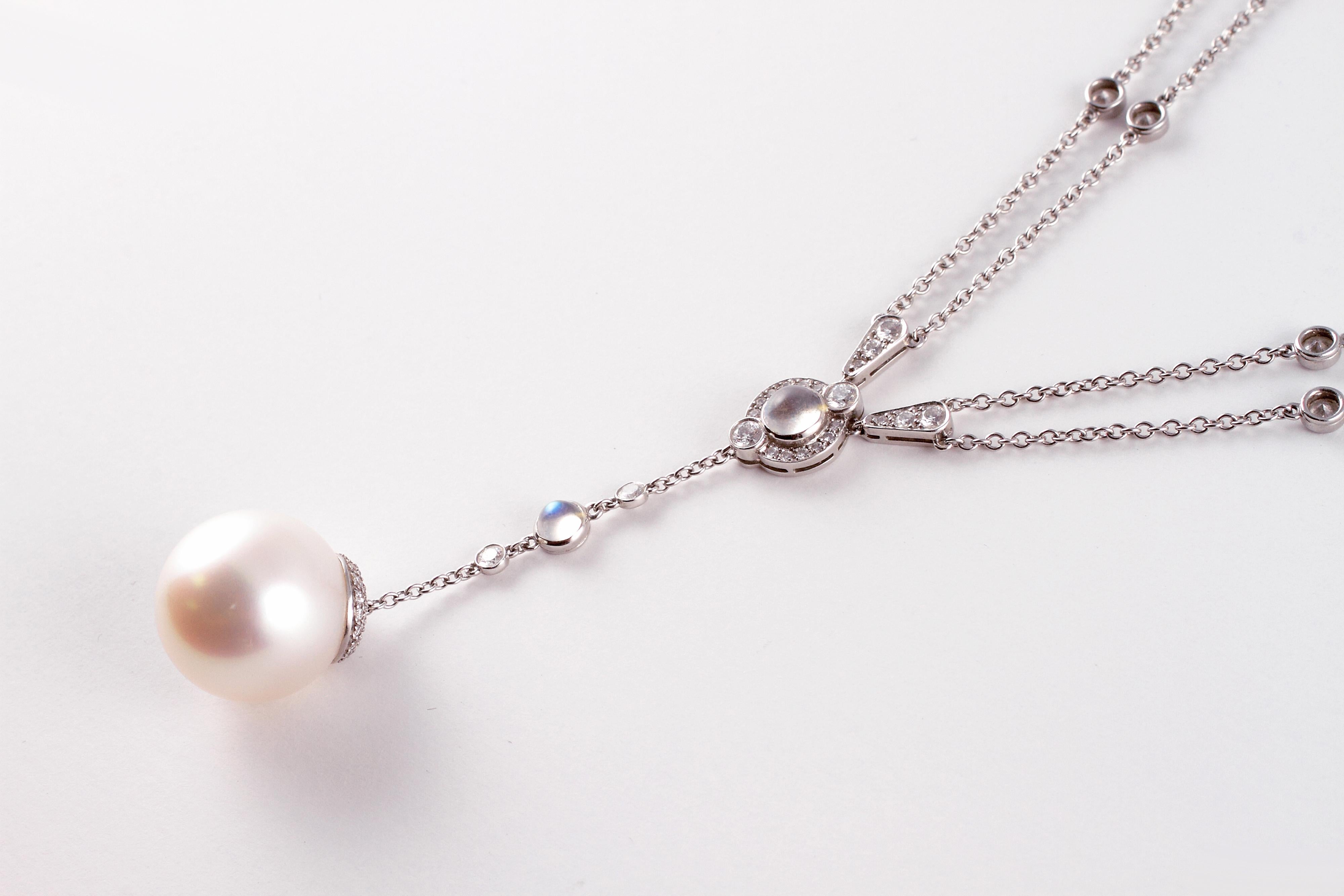 From Tiffany & Company..... this platinum, South Sea cultured pearl, moonstone and diamond necklace features  one 16.10 mm South Sea pearl, cabochon-cut moonstones and 3.02 carats of sparking diamonds stated to be VS in clarity and G in color.   The