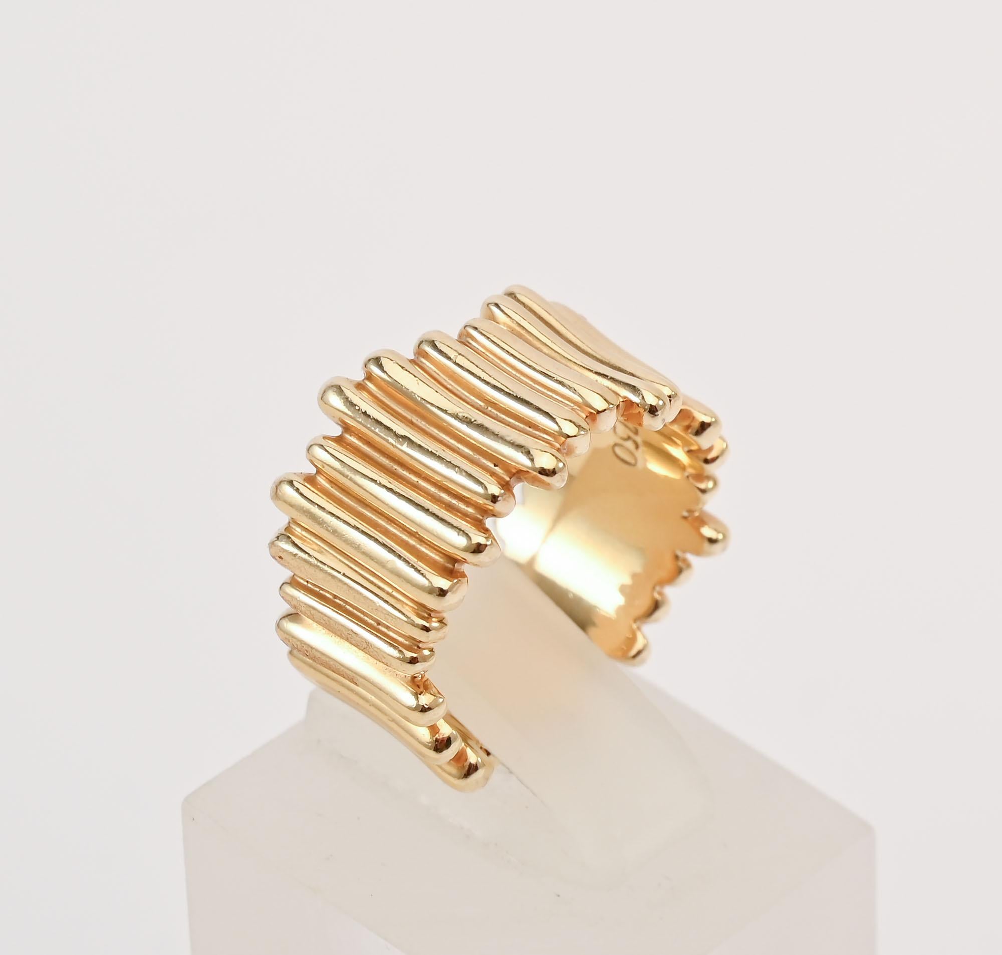 Unusual Tiffany  band ring made of gold strips of varying sizes. They vary from as long as 7/16
