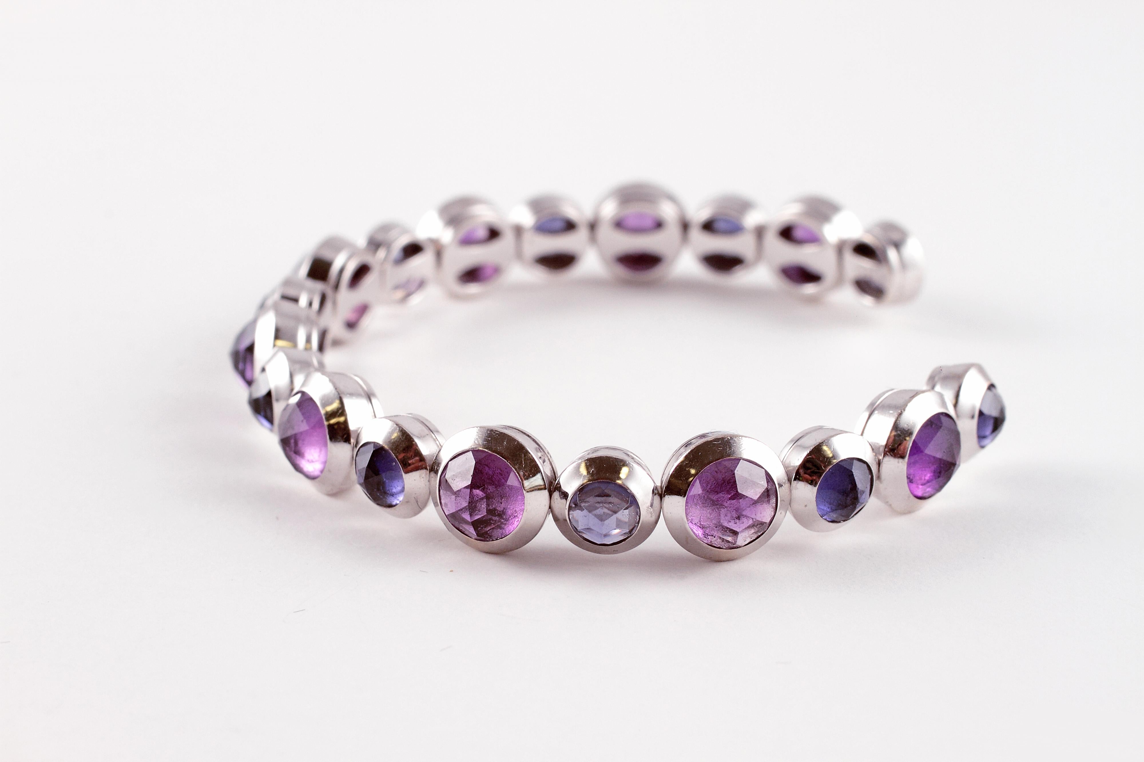 Rose-cut stones are so stunning and a bit out of the norm! This striking 18 karat white gold, cuff bracelet by Tiffany is a great example. With rose-cut iolites and amethysts, this bracelet would make any heart race!