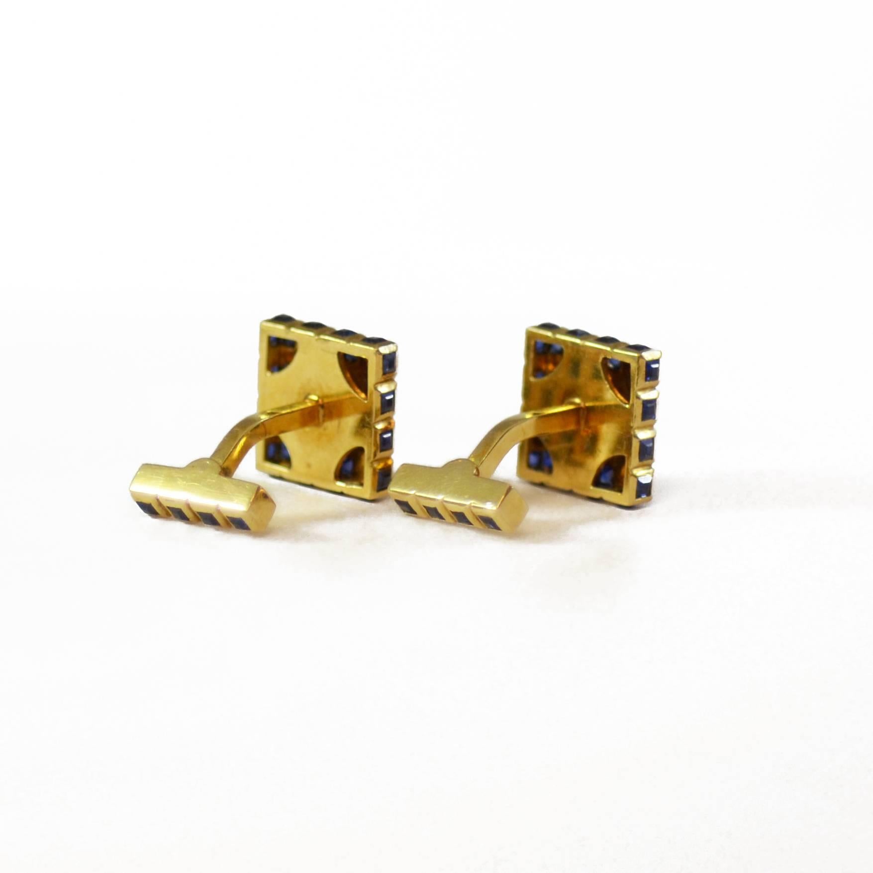 Pair of square shaped cufflinks by Tifffany & Co. Set with sapphires in a grid pattern and mounted in 18ct yellow gold. American, circa 1950.