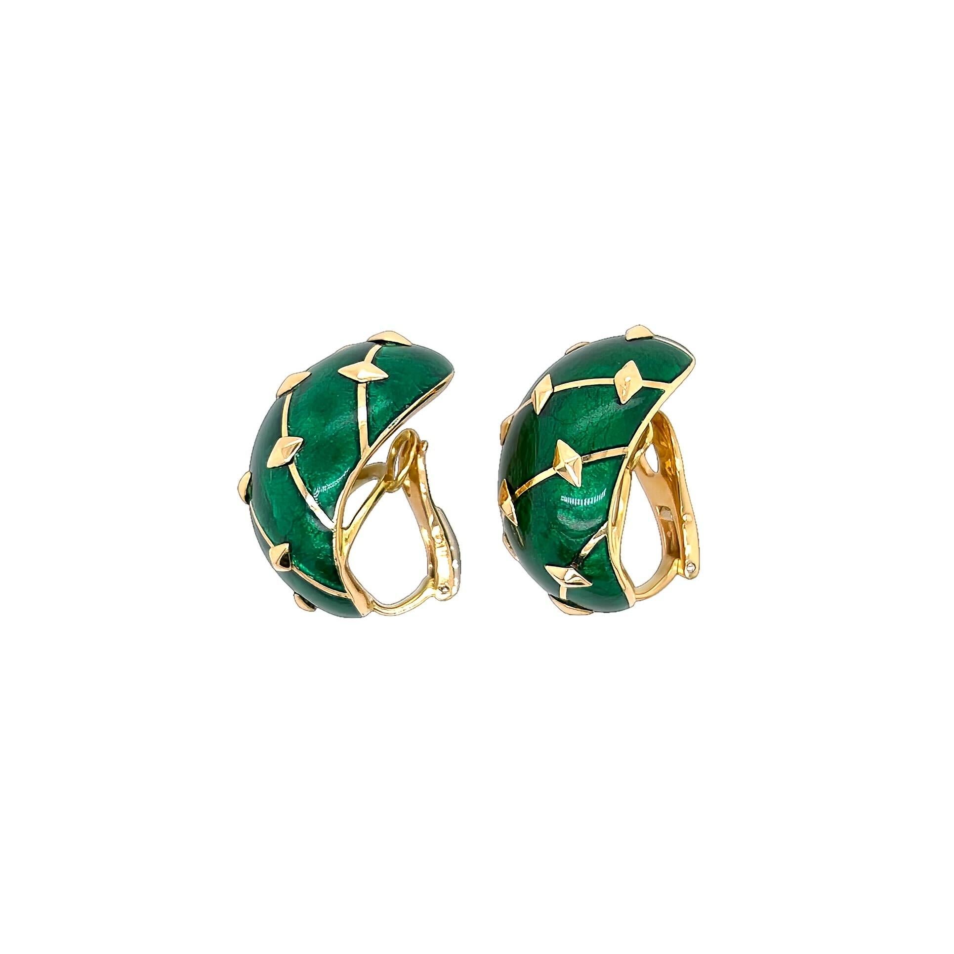 A pair of 18 karat yellow gold and enamel earclips, Schlumberger, Tiffany & Co., France.  Each Banana earclip designed as a bombe oval of green paillonne enamel with diagonals of gold studded with gold navettes.  Length approximately 1 1/8 inches. 