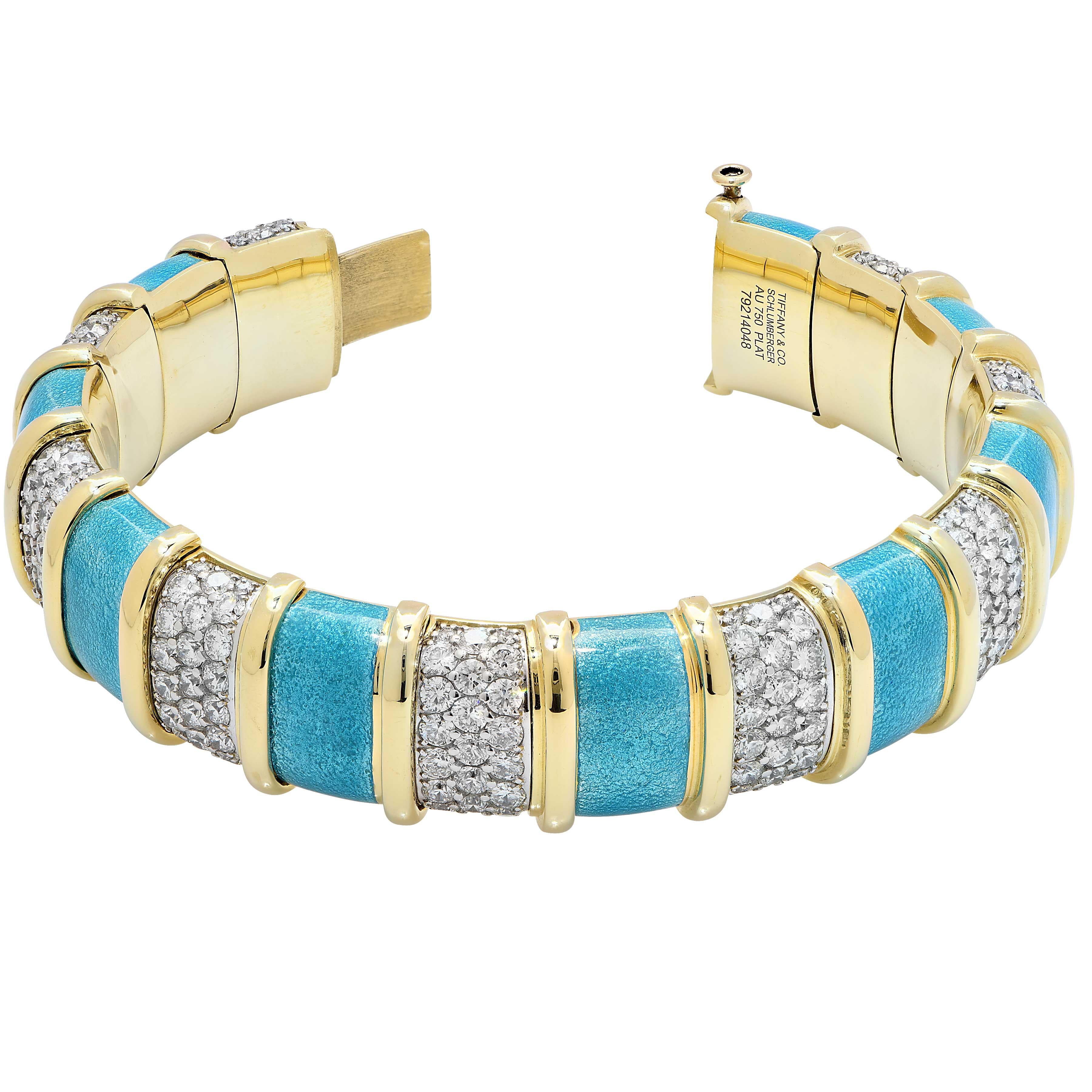 Tiffany Schlumberger Blue Enamel and Diamond Bracelet featuring 9 links with a total of 207 prong set round brilliant cut diamonds with a total estimated carat weight of 20 carats set in platinum and nine panels of blue enamel in 18 karat yellow