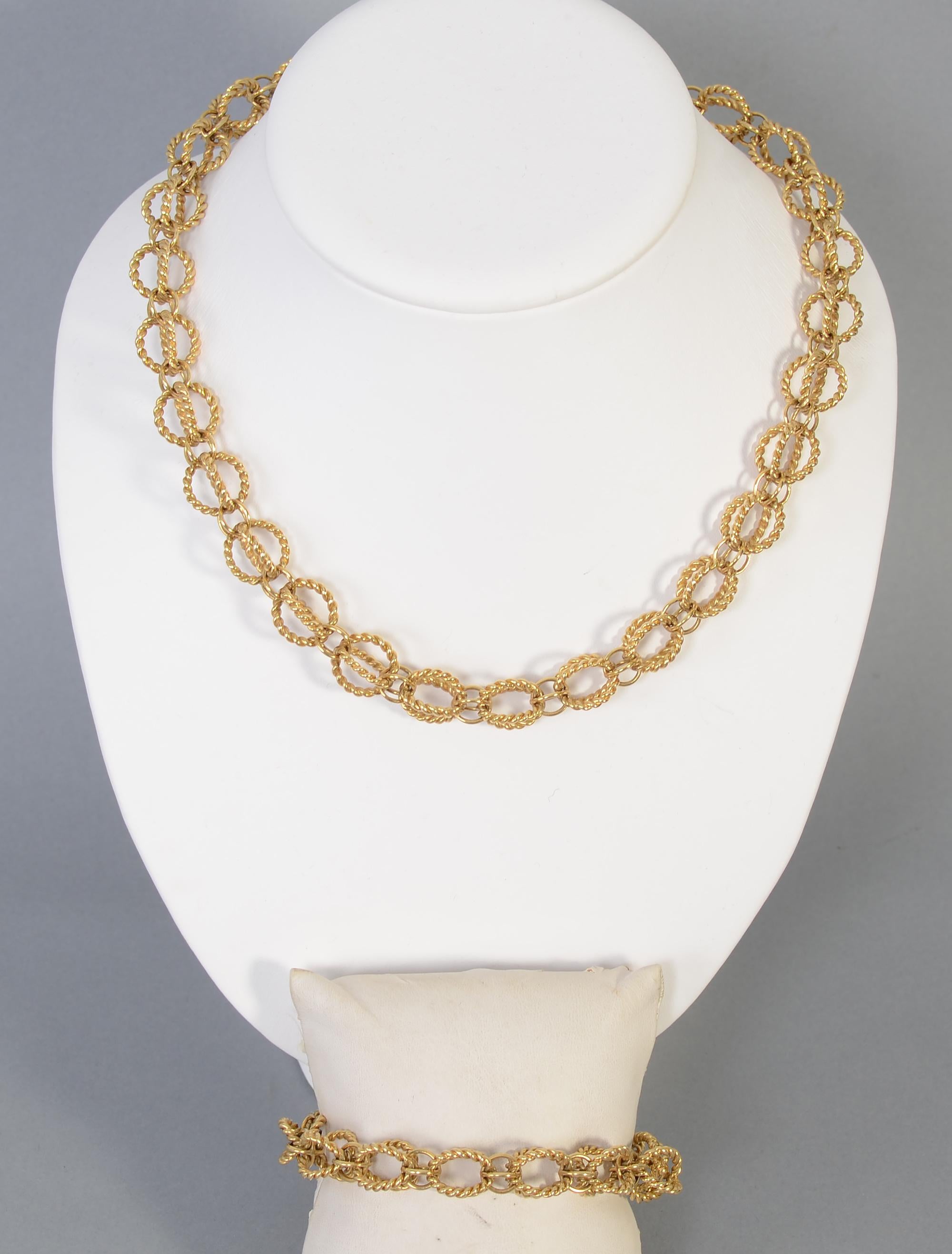 Schlumberger for Tiffany 18 karat gold circles necklace and bracelet.  Twisted gold three dimensional circles alternate with smaller smooth ones. The twisted circles are half an inch in diameter. The necklace is 18 inches in length and the bracelet