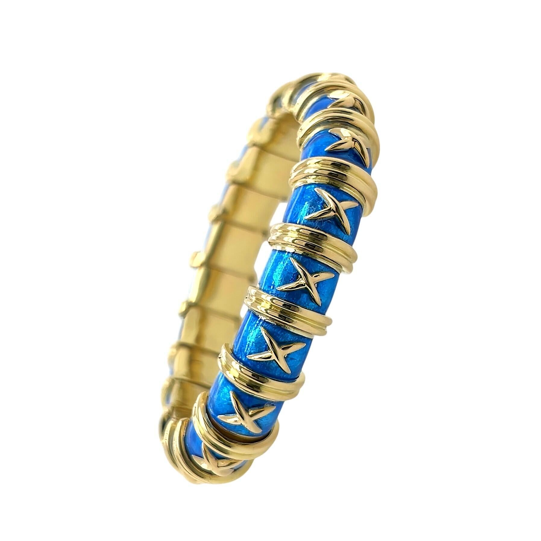 An 18 karat yellow gold and enamel bracelet, Tiffany & Co., Schlumberger.  The Croisillon bracelet is composed of 19 convex gold links enameled in blue and applied with a yellow gold 