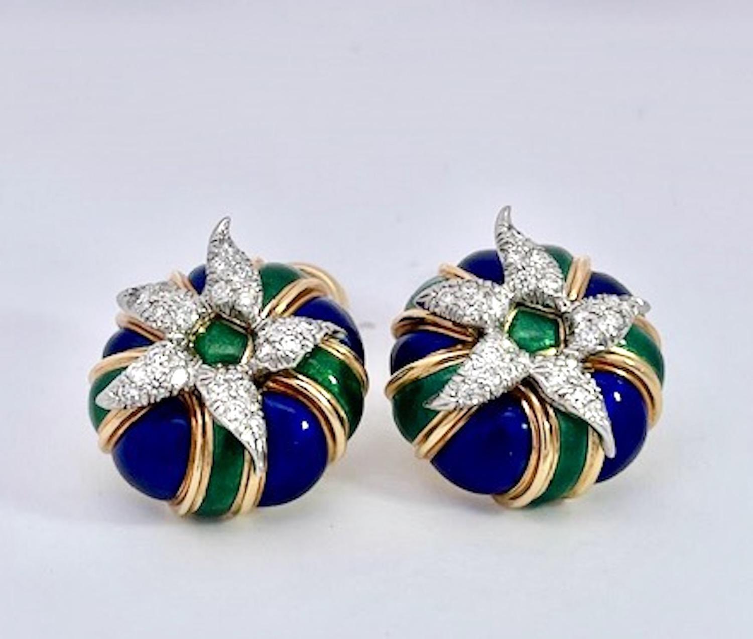These Schlumberger earrings are special.  They are set in 18K Yellow Gold with Blue and Green enamel and a Diamond starburst in the center.  The Diamonds are set in Platinum as all Schlumberger  pieces are and these are round.  They measure