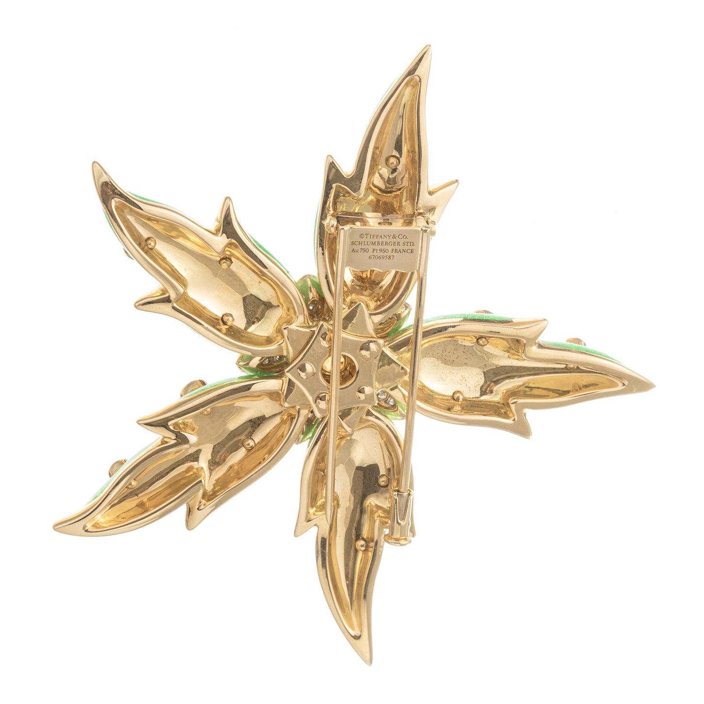 Jean Schlumberger for Tiffany starfish pin in 18k yellow gold, decorated in bright sea foam green enamel with round-cut spessartite garnet accents and centering a larger round-cut spessartite garnet surrounded by pear-shaped tanzanites and round