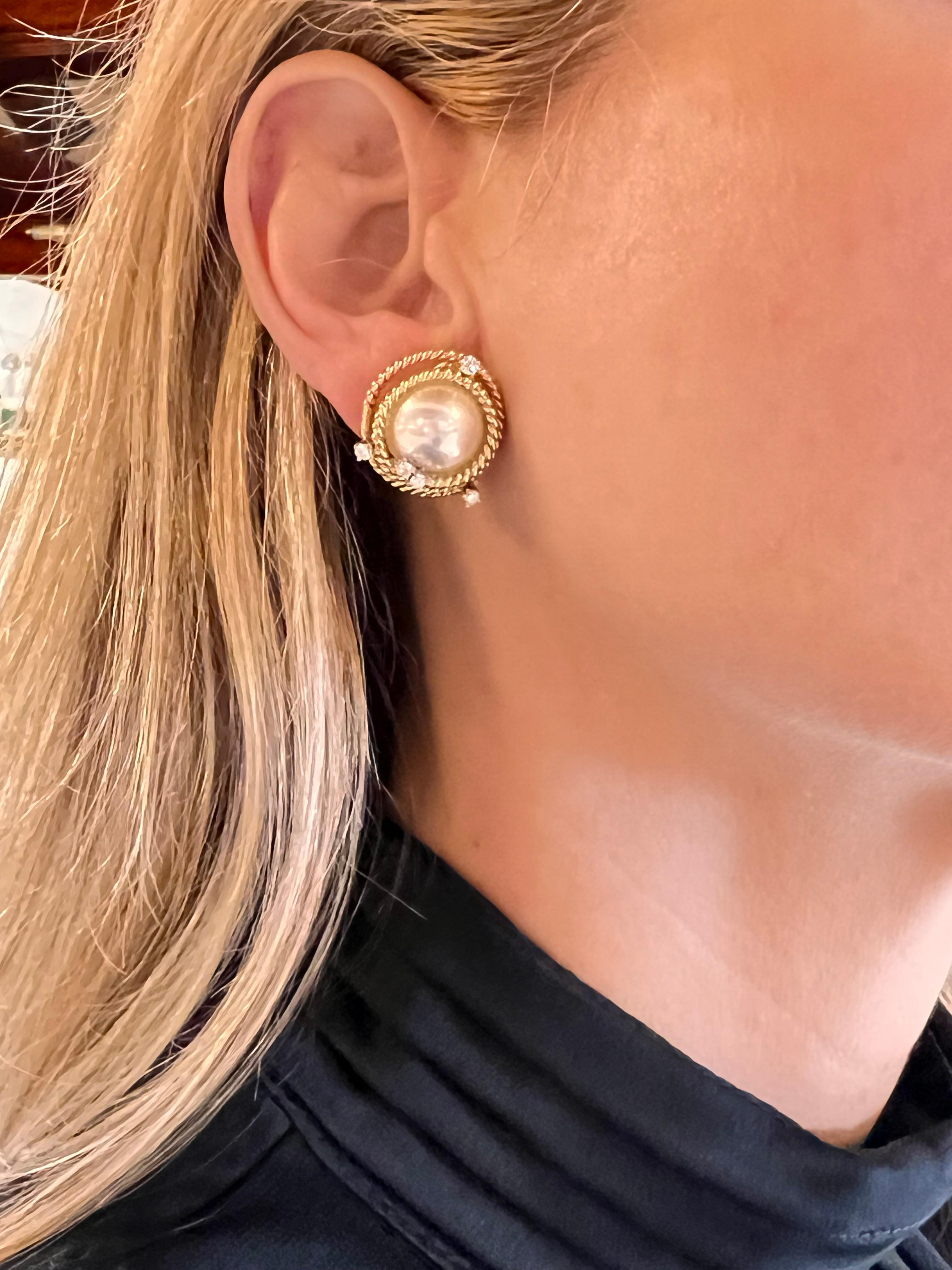 Pair of classic rope-twist earrings, designed by Jean Schlumberger for Tiffany & Co, set in 18k yellow gold and platinum. Centering high luster mabe pearls measuring approximately 15.5mm.  Twisted rope design accented by ten round full cut diamonds