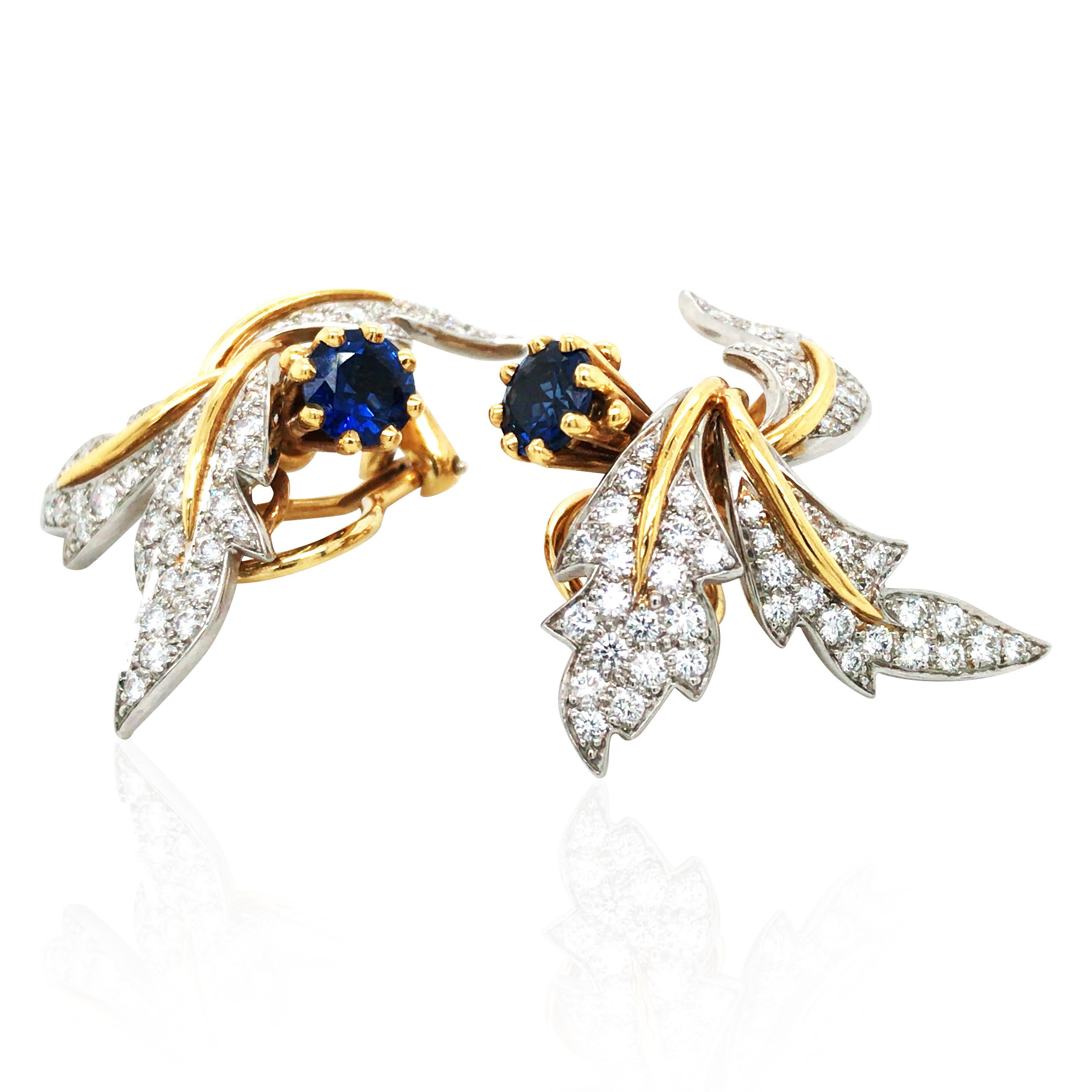 These TIFFANY earrings are exquisitely lively, with a refined design that perfectly combines elegance and dynamism. The clever mix of 18K gold and platinum is adorned with approximately 2.3ct of diamonds and 1.5ct of sapphires, radiating a unique