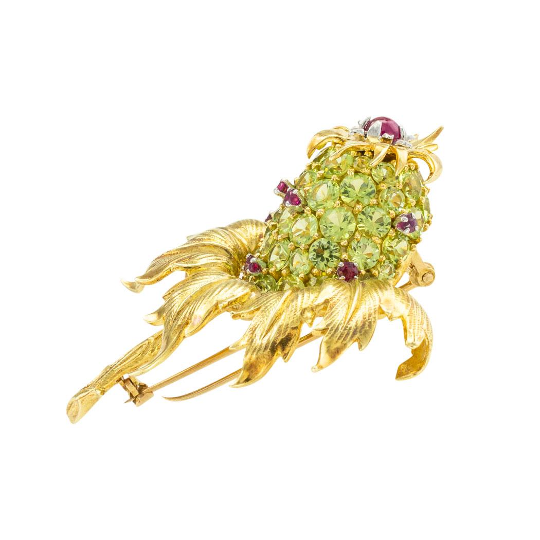 Tiffany Schlumberger peridot and ruby gold thistle clip brooch circa 1960.  *

ABOUT THIS ITEM:  #P-DJ125G. Scroll down for detailed specifications.  The thistle brooch is one of the many iconic pieces Jean Schlumberger designed in collaboration