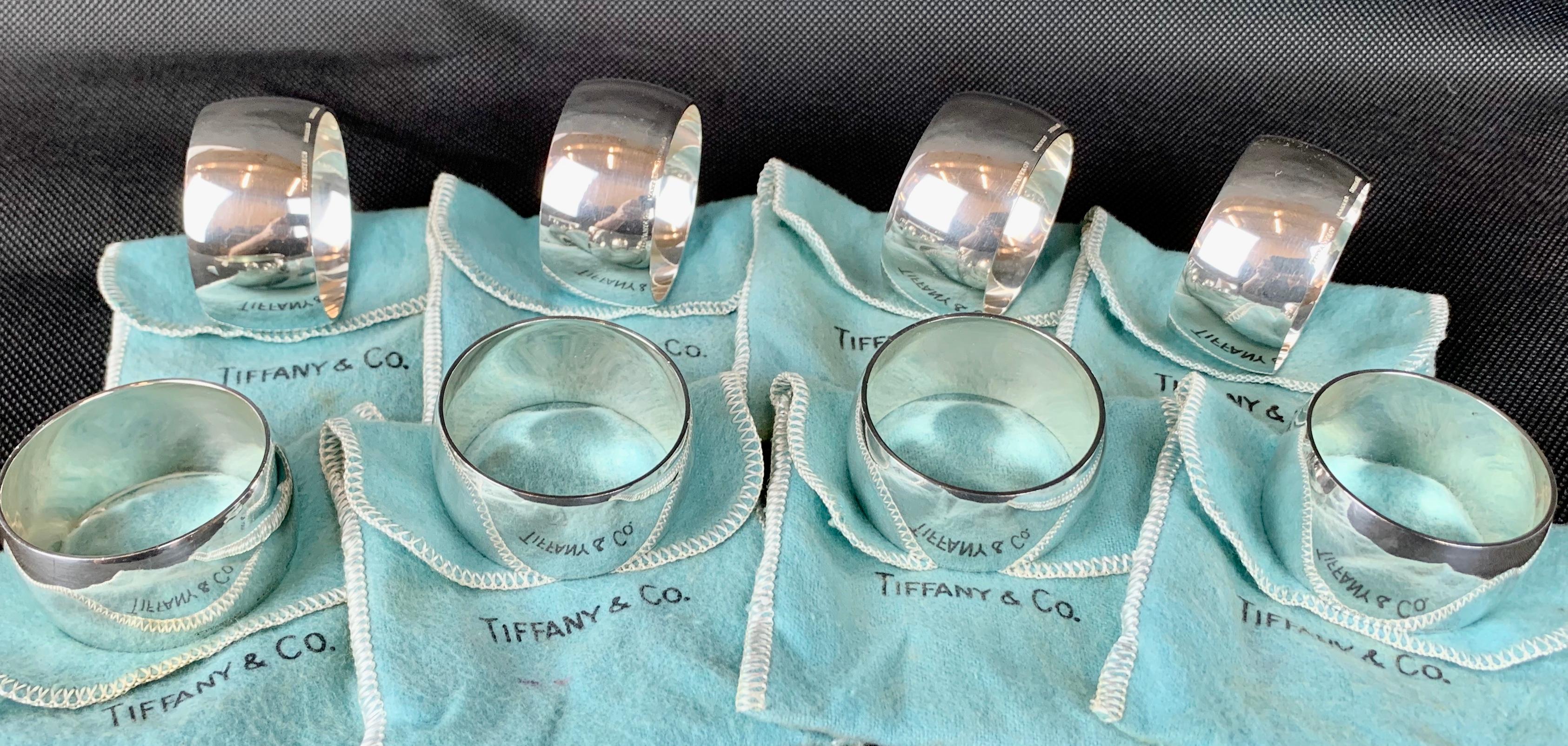 Set of eight vintage Tiffany sterling silver napkin rings each with its own Tiffany blue storage bag. This set of napkin rings have not been monogrammed and they are in great condition. They are marked on the front bottom edge (see photos).
10.4