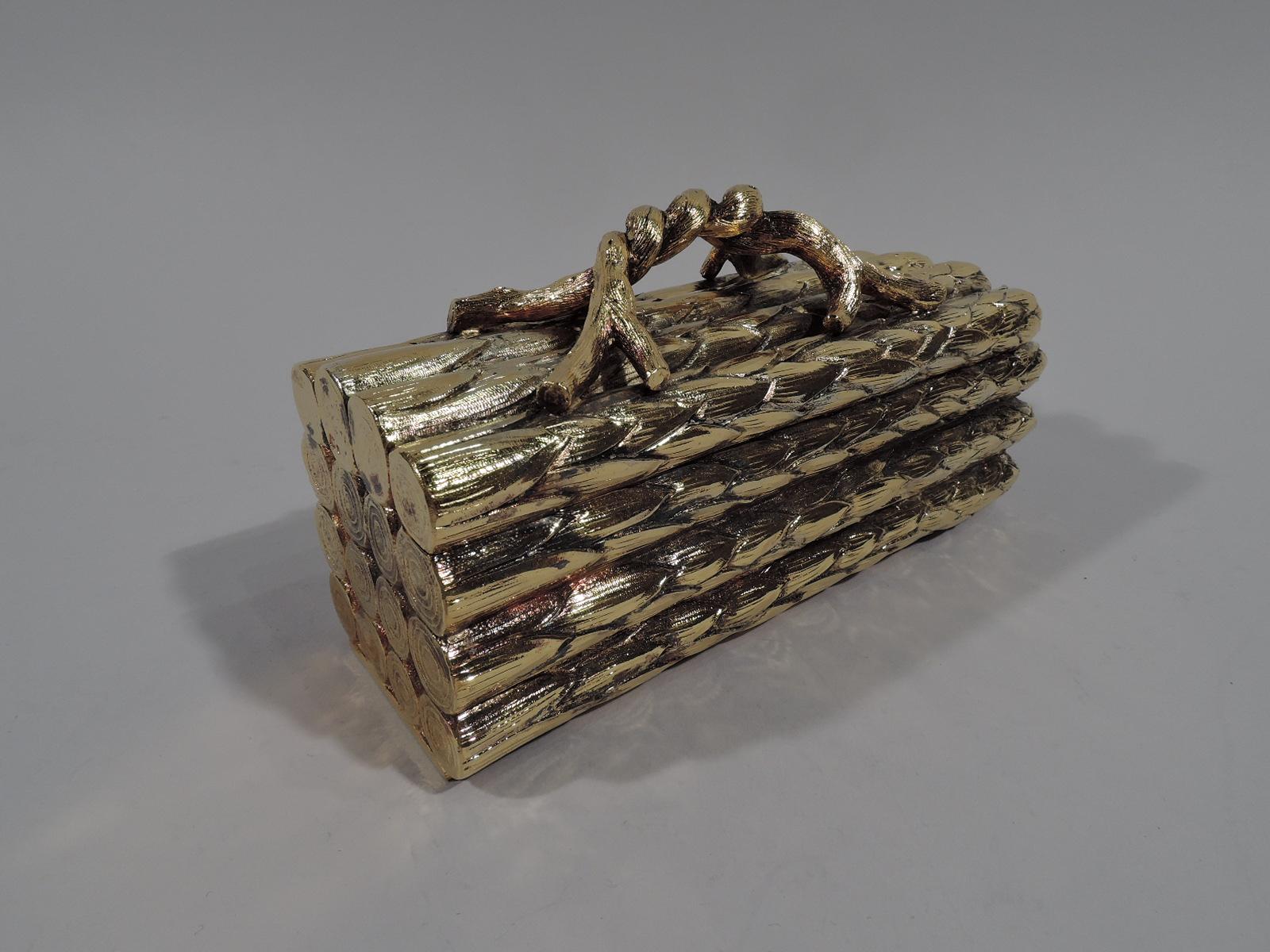 Figural gilt sterling silver box. Retailed by Tiffany & Co. in New York. In form of neatly aligned asparagus stalks, the ends bluntly cut. Twisted wood stem handle. Jokey novelty. Marked “Tiffany & Co. / Sterling / Portugal”. 

Overall dimensions: